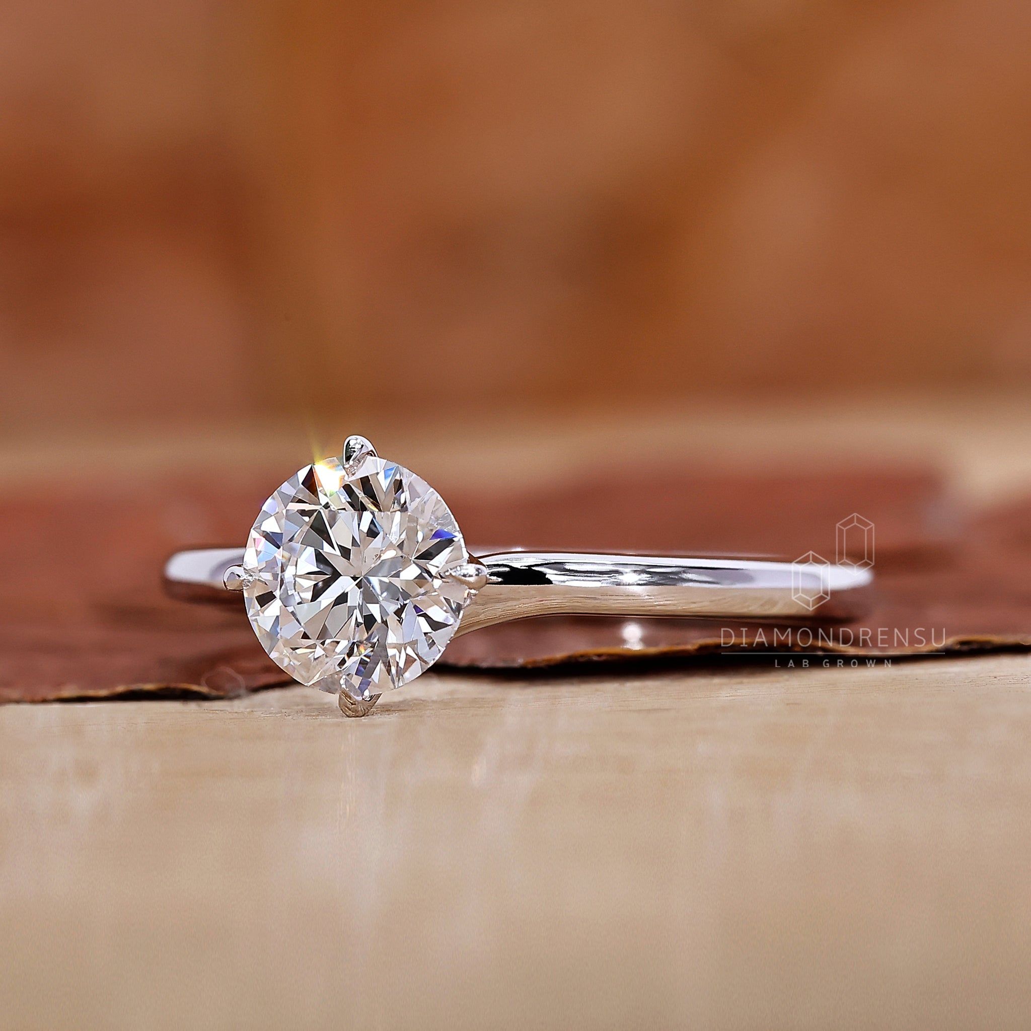 Round cut solitaire ring placed in white gold ring.
