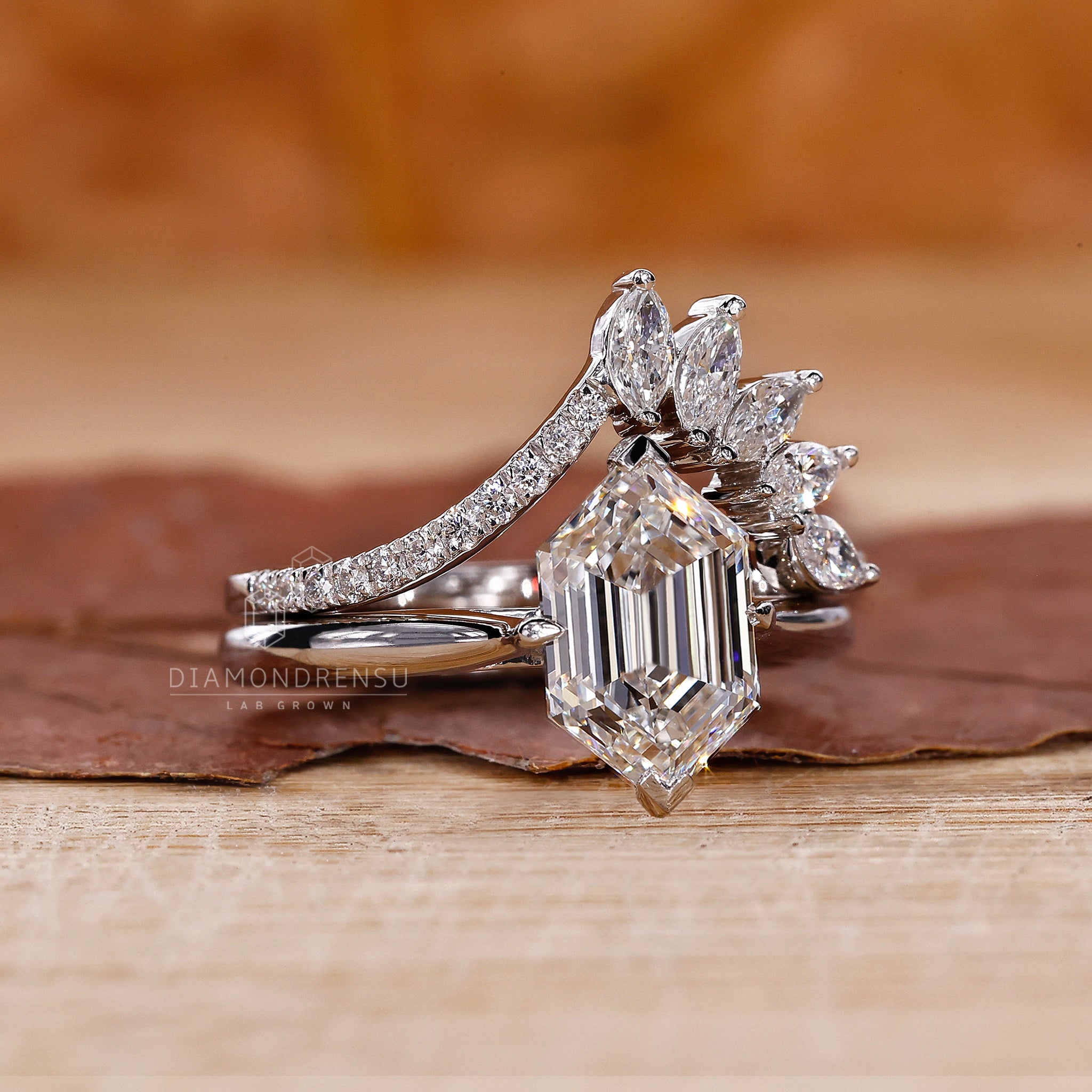 Custom white gold bridal set with a prong set curved wedding band.
