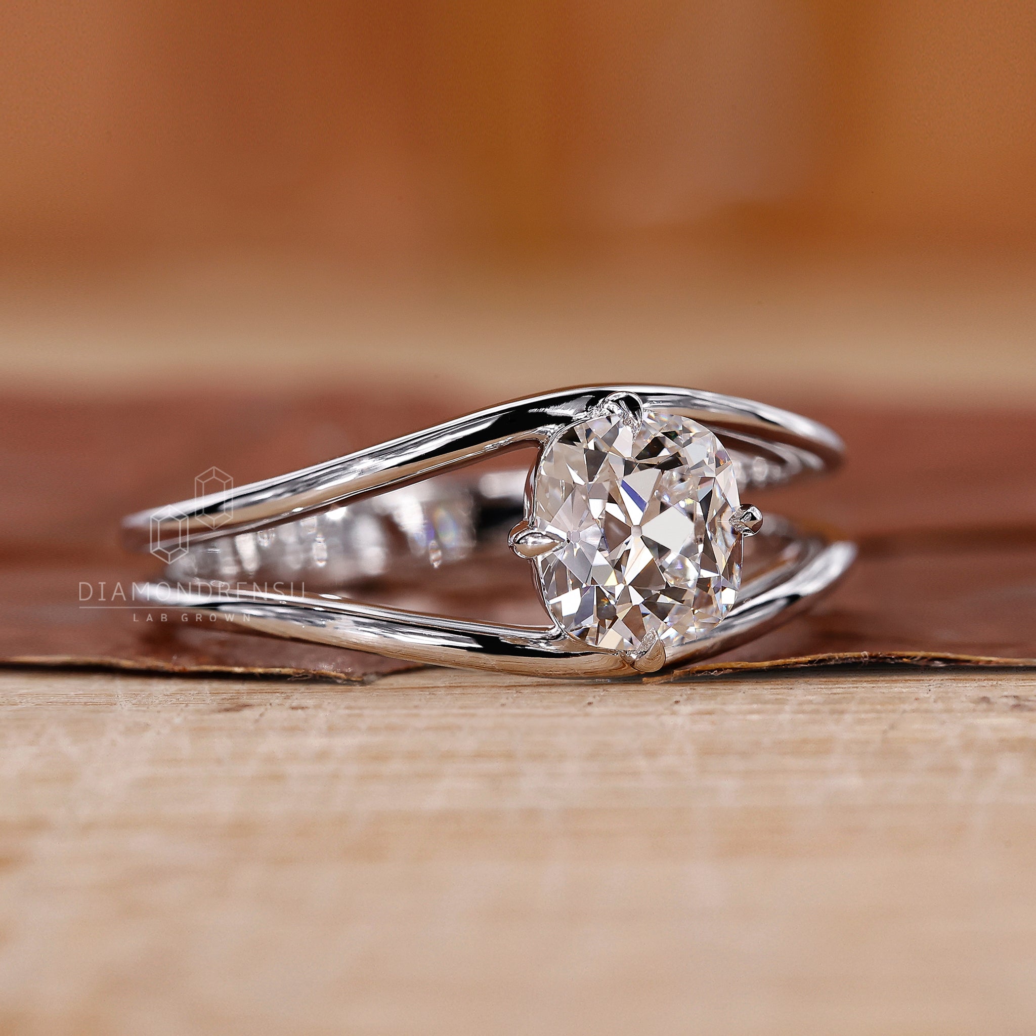 Compass prong setting on yellow gold diamond ring.
