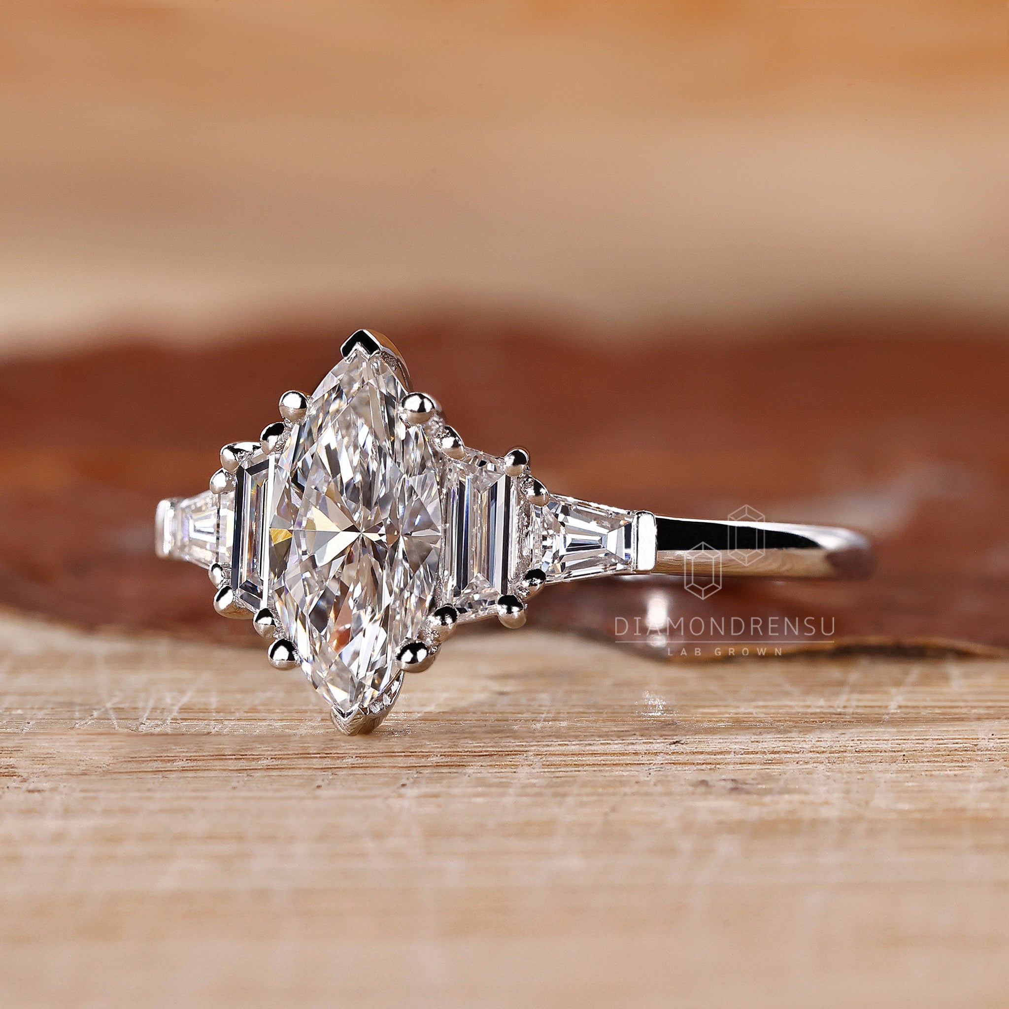 5 stone ring comes with marquise cut diamond ring and tapered side stones.
