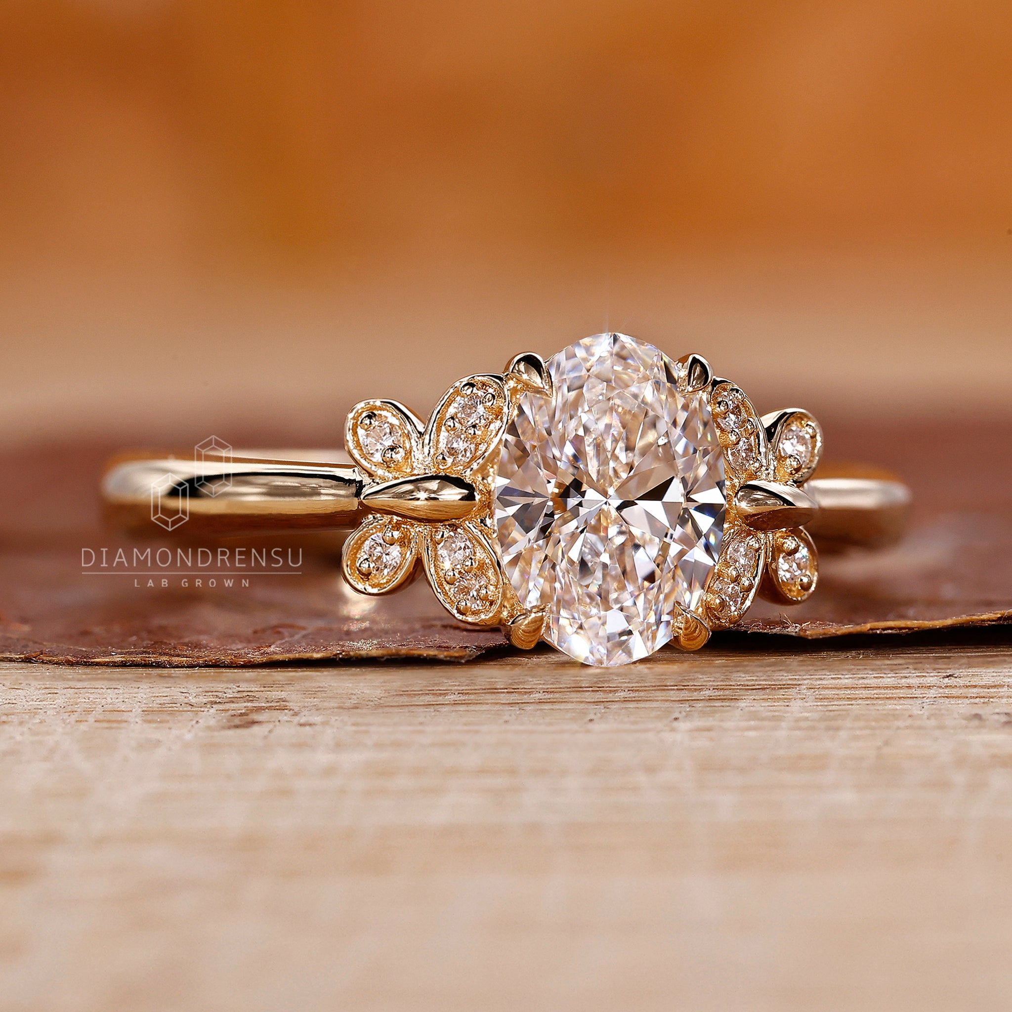 UK engagement ring is made with oval and round diamonds.
