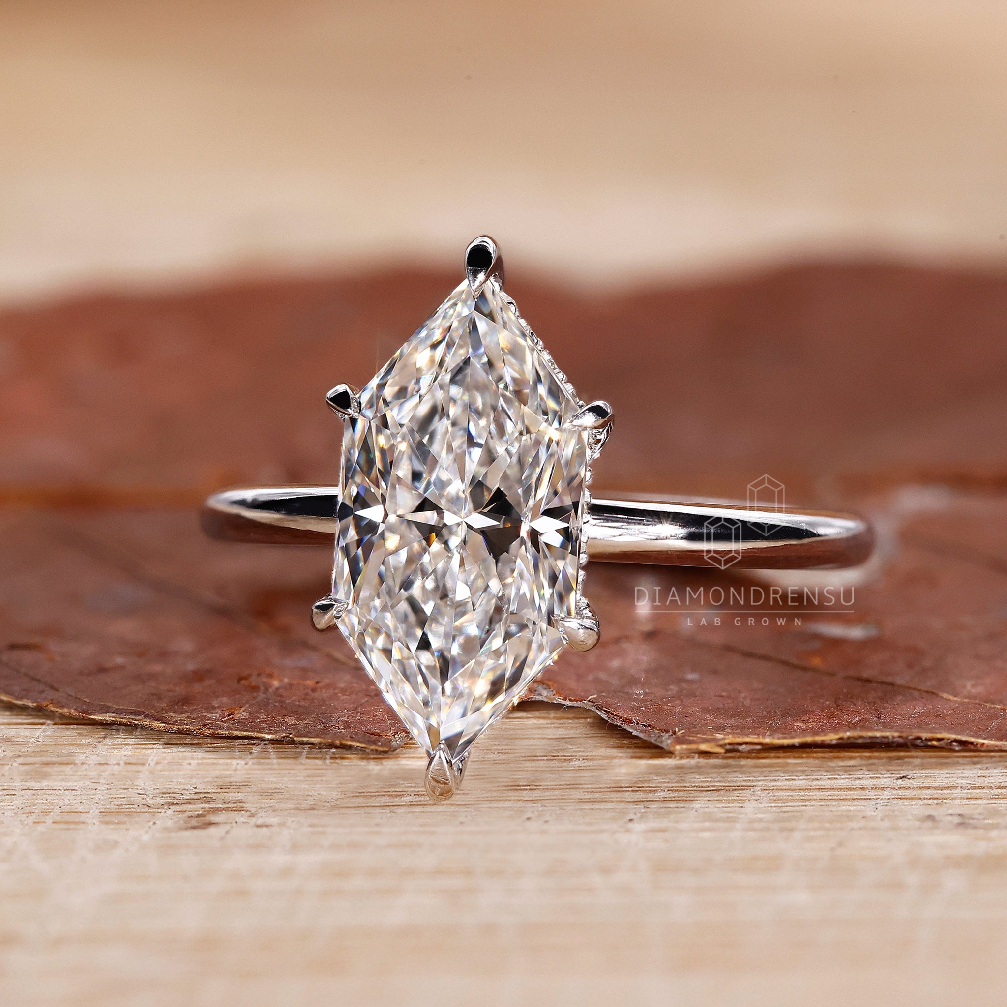 Simple diamond ring crafted as hidden halo engagement ring.
