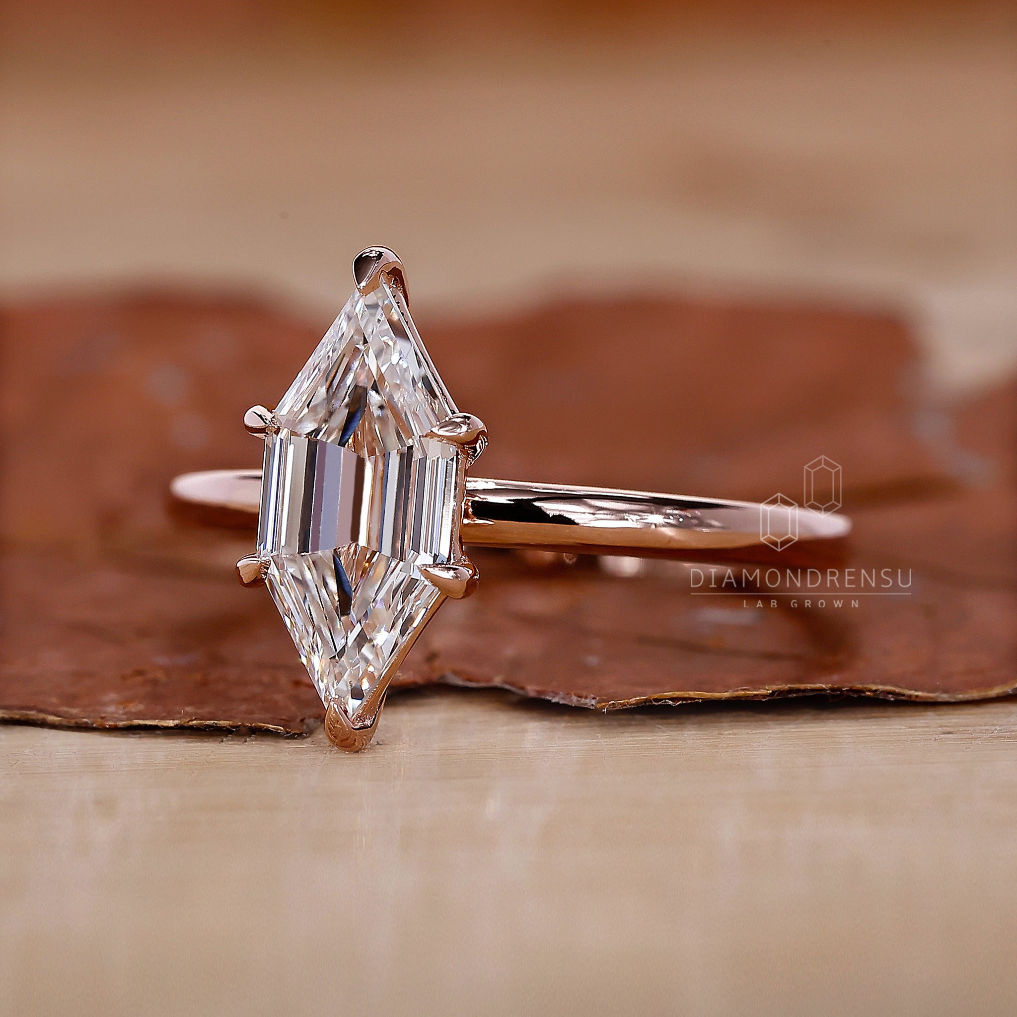 Rose gold ring with a modern hexagon cut and sleek finish.
