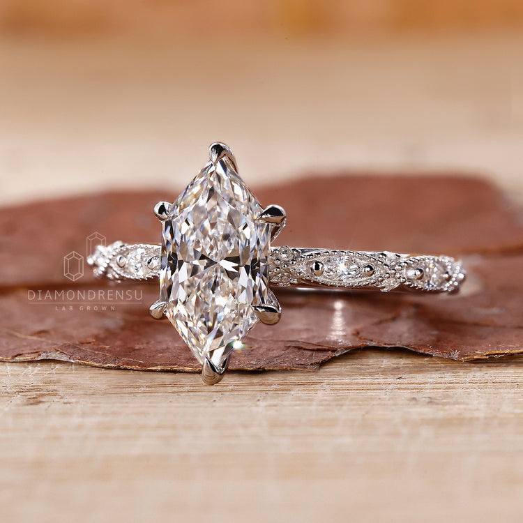 Milgrain setting highlights the marquise shape outline.
