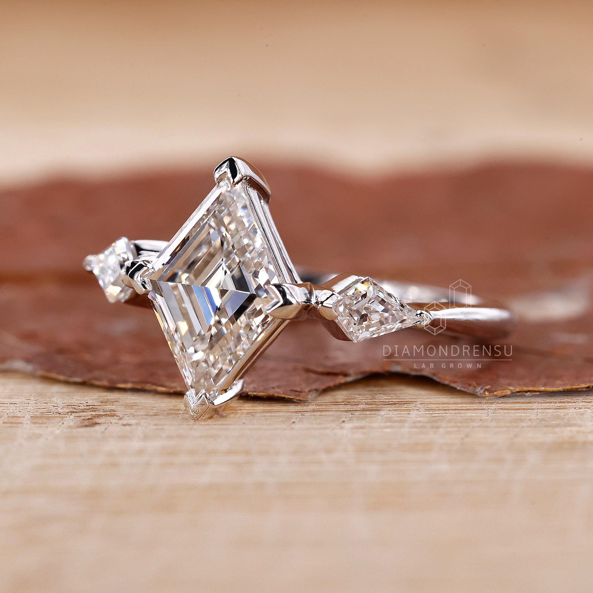 Buy engagement ring featuring lozenge cut ring.
