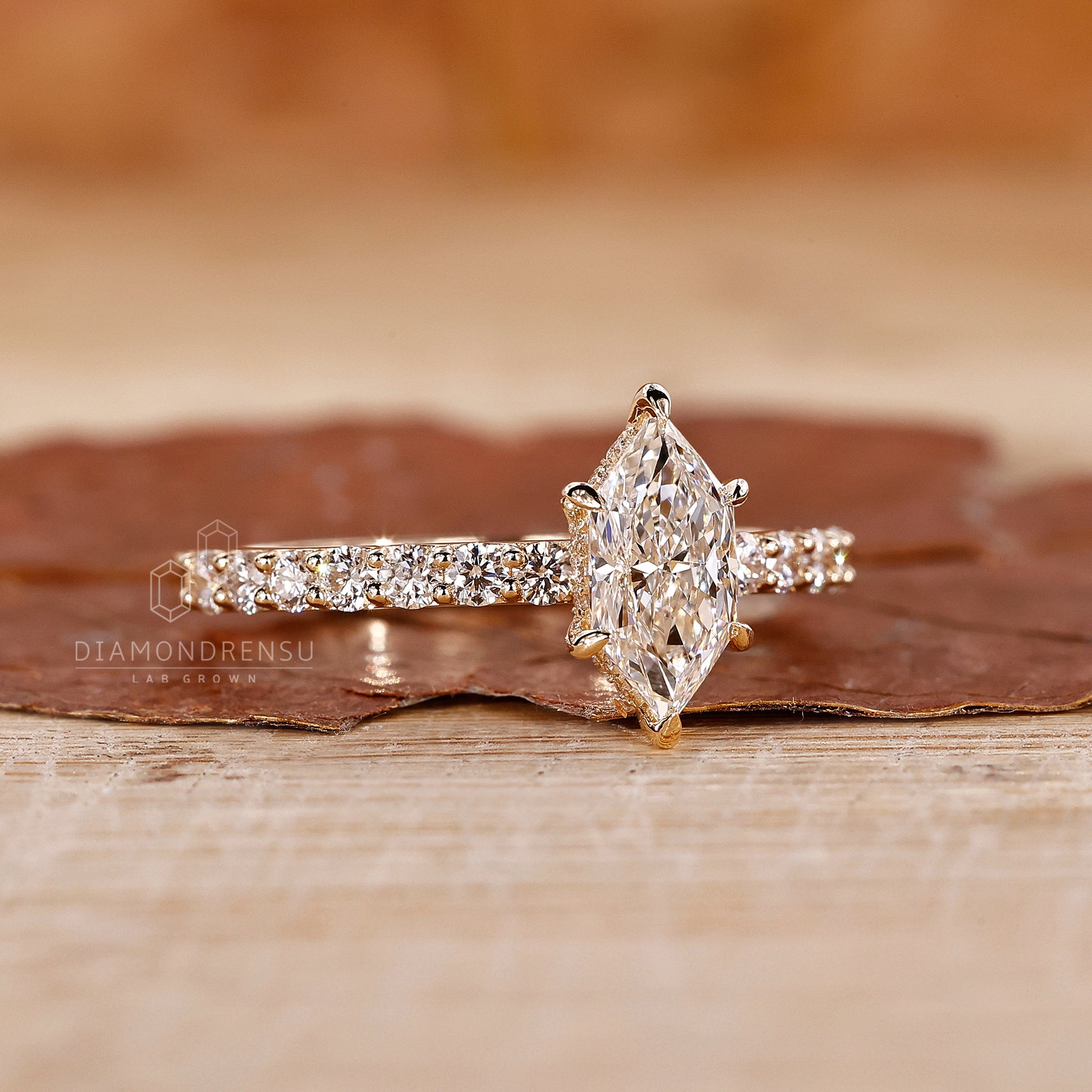 Hidden halo engagement ring includes 6 claw prong ring detail.

