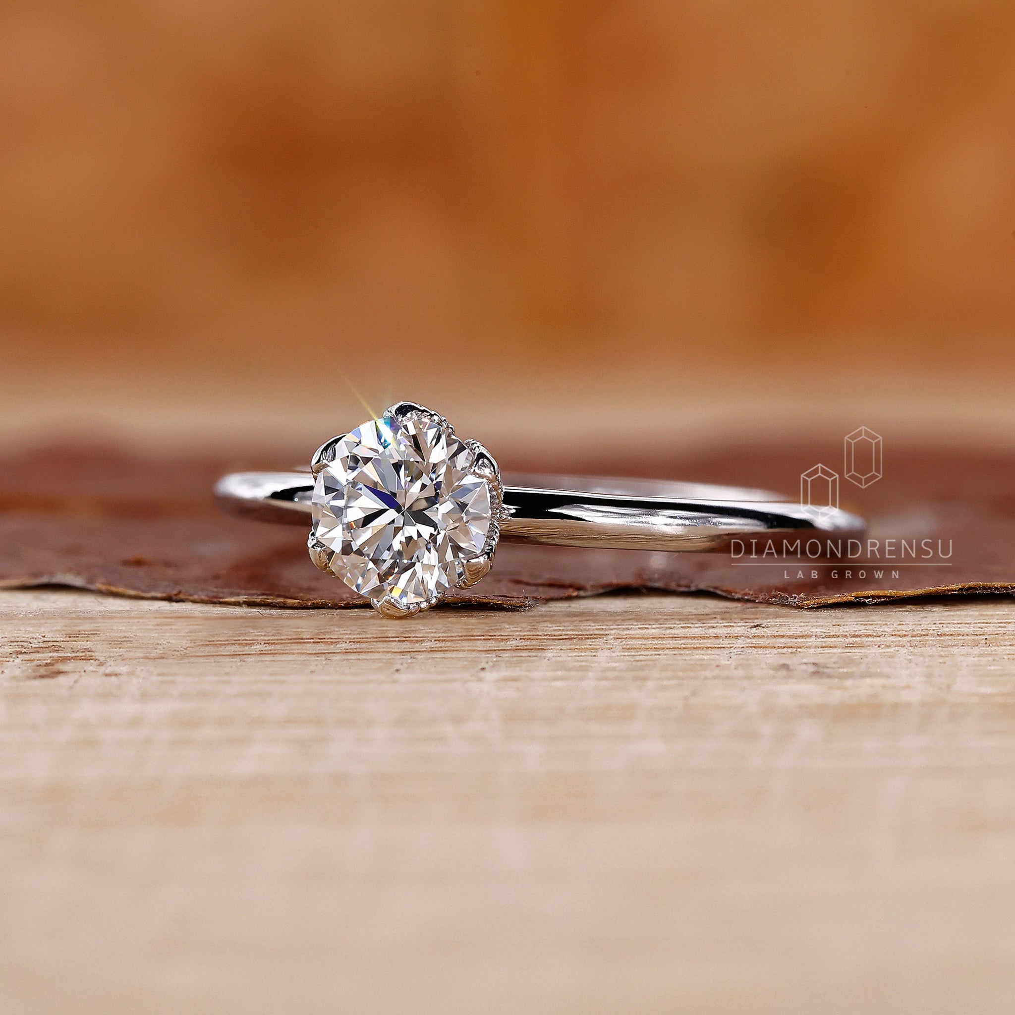 Round diamond engagement ring made as simple engagement ring.
