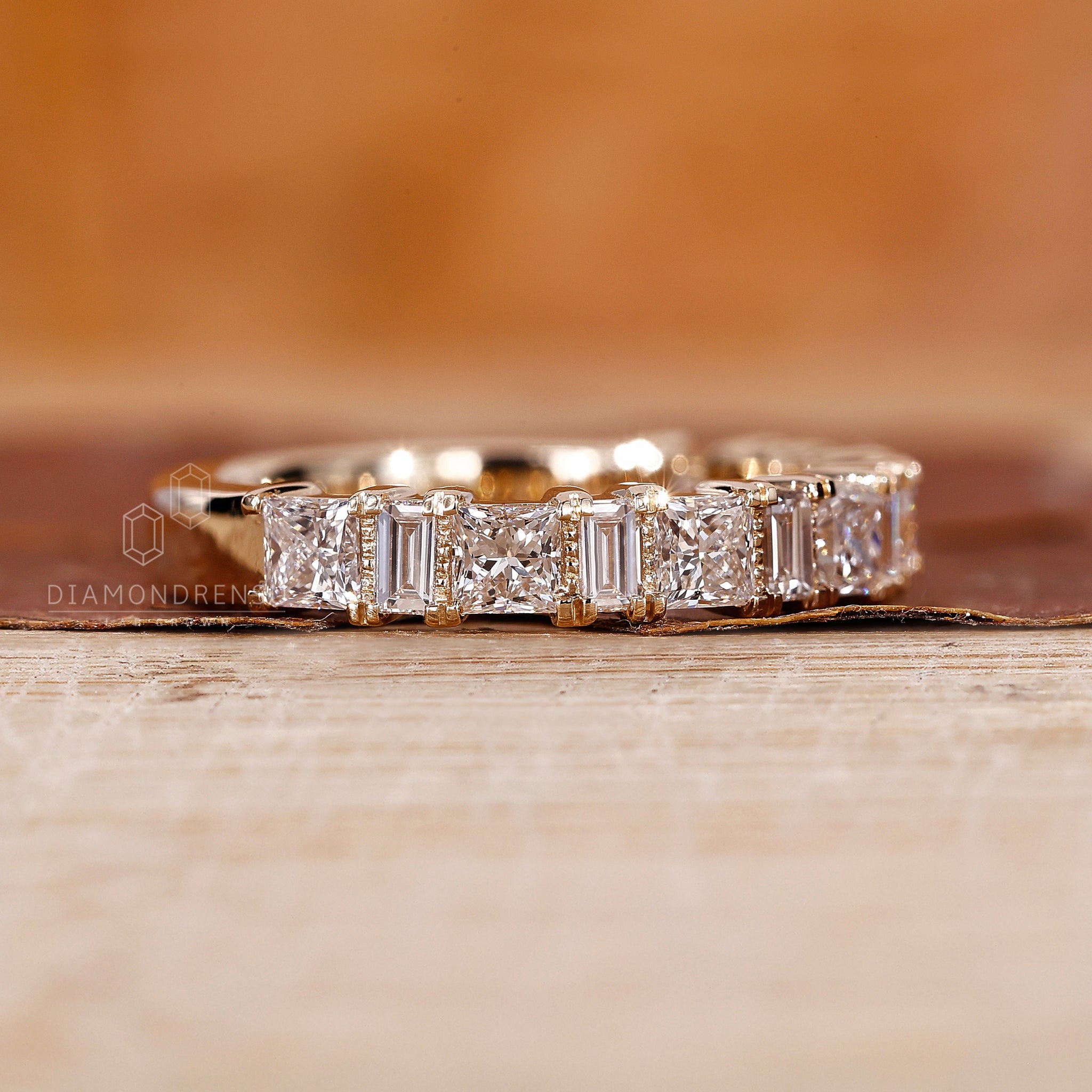 Buy wedding band in yellow gold with a unique diamond layout.