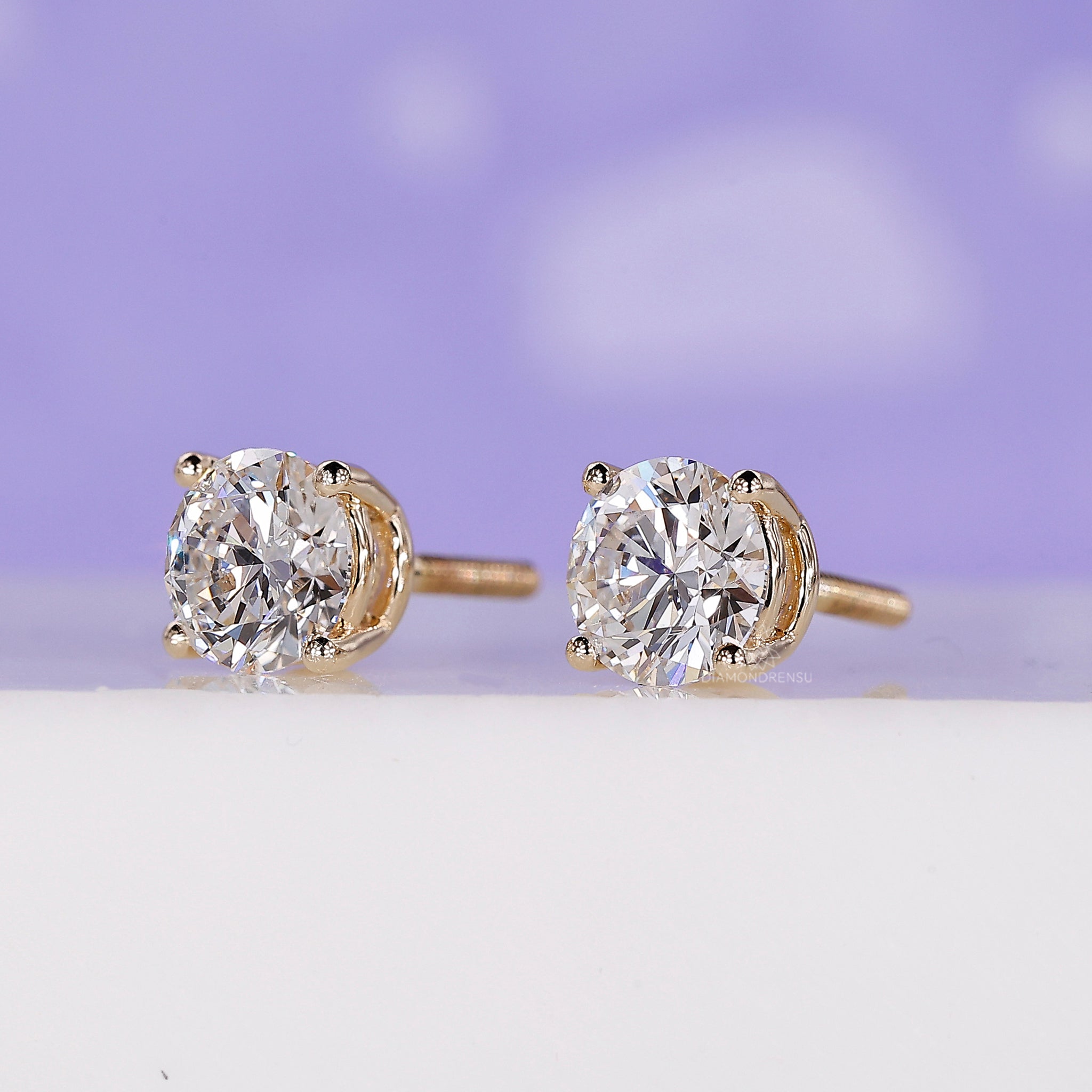 Diamond stud earrings UK made with gold and lab grown stones.
