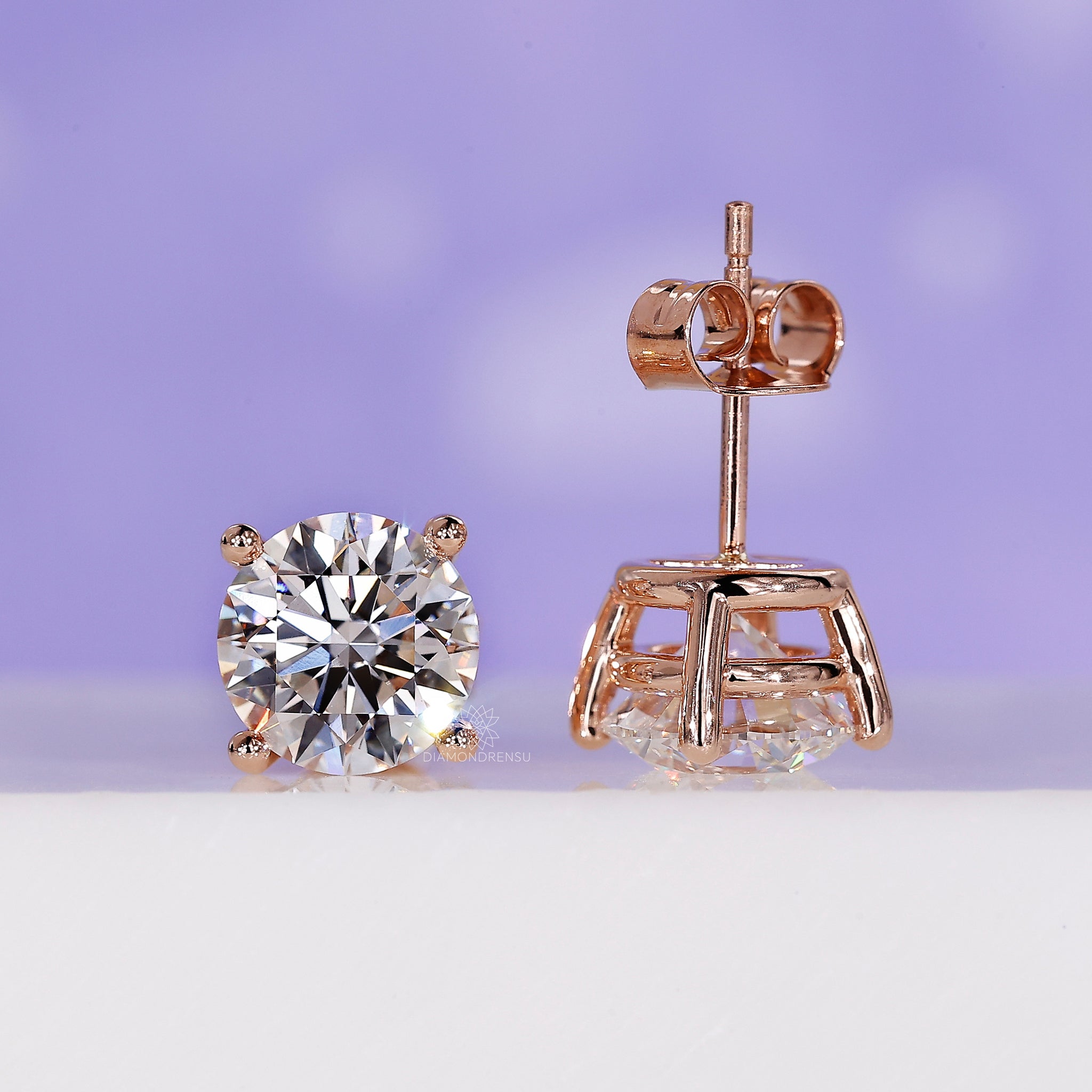 Round brilliant cut diamond stud earrings.