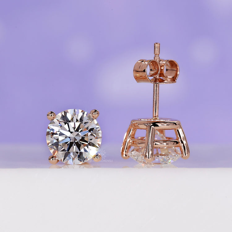 Round brilliant cut diamond stud earrings.