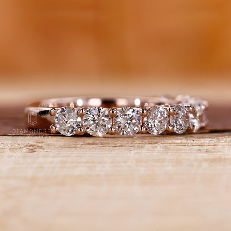 Round diamond wedding band in prong setting
