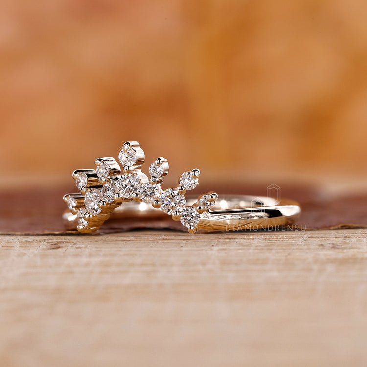 Yellow gold wedding band in prong setting
