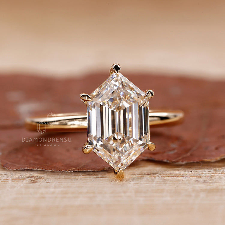 Buy engagement ring online with hexagon cut diamond and gold band.
