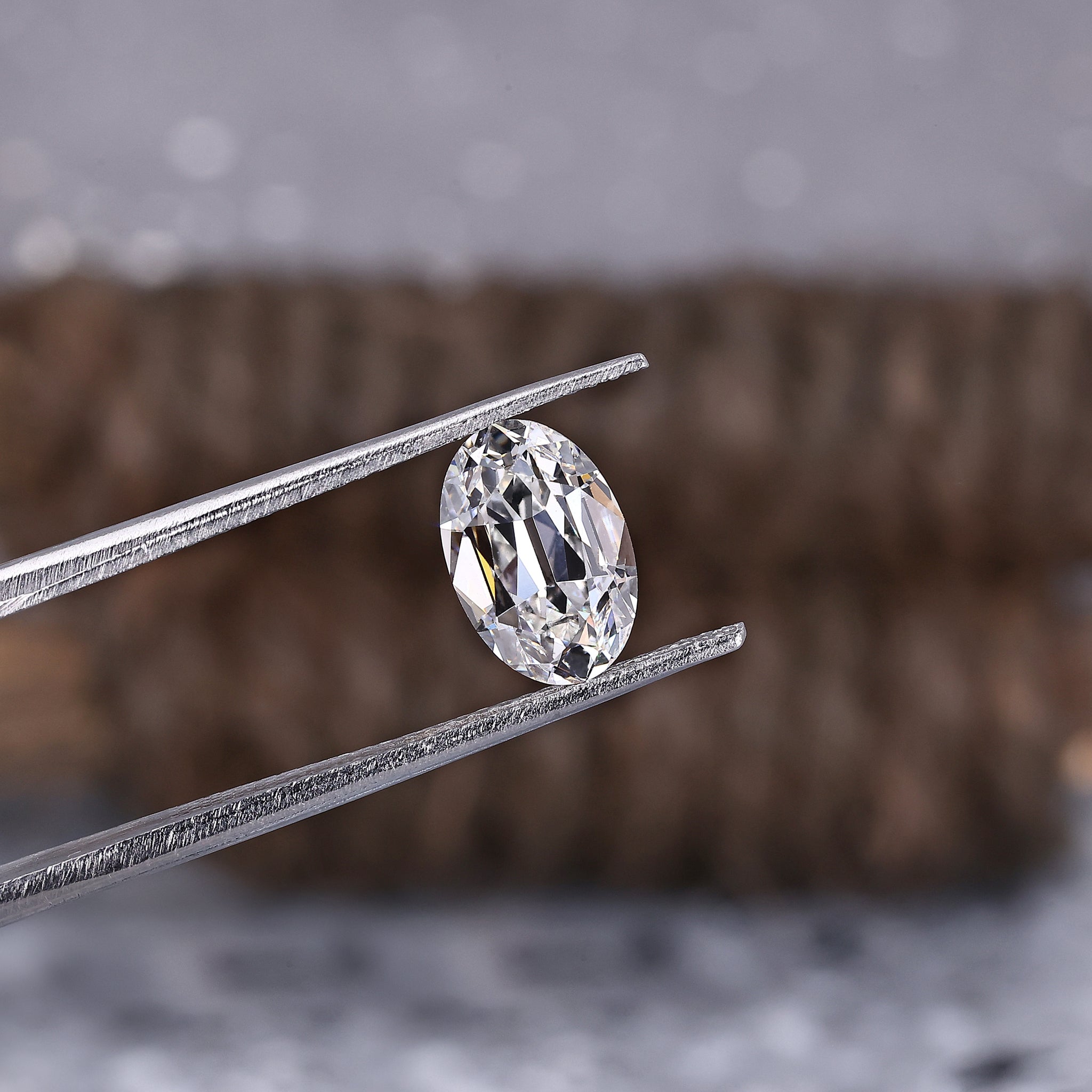 Oval lab grown diamond with antique-inspired old mine faceting.
