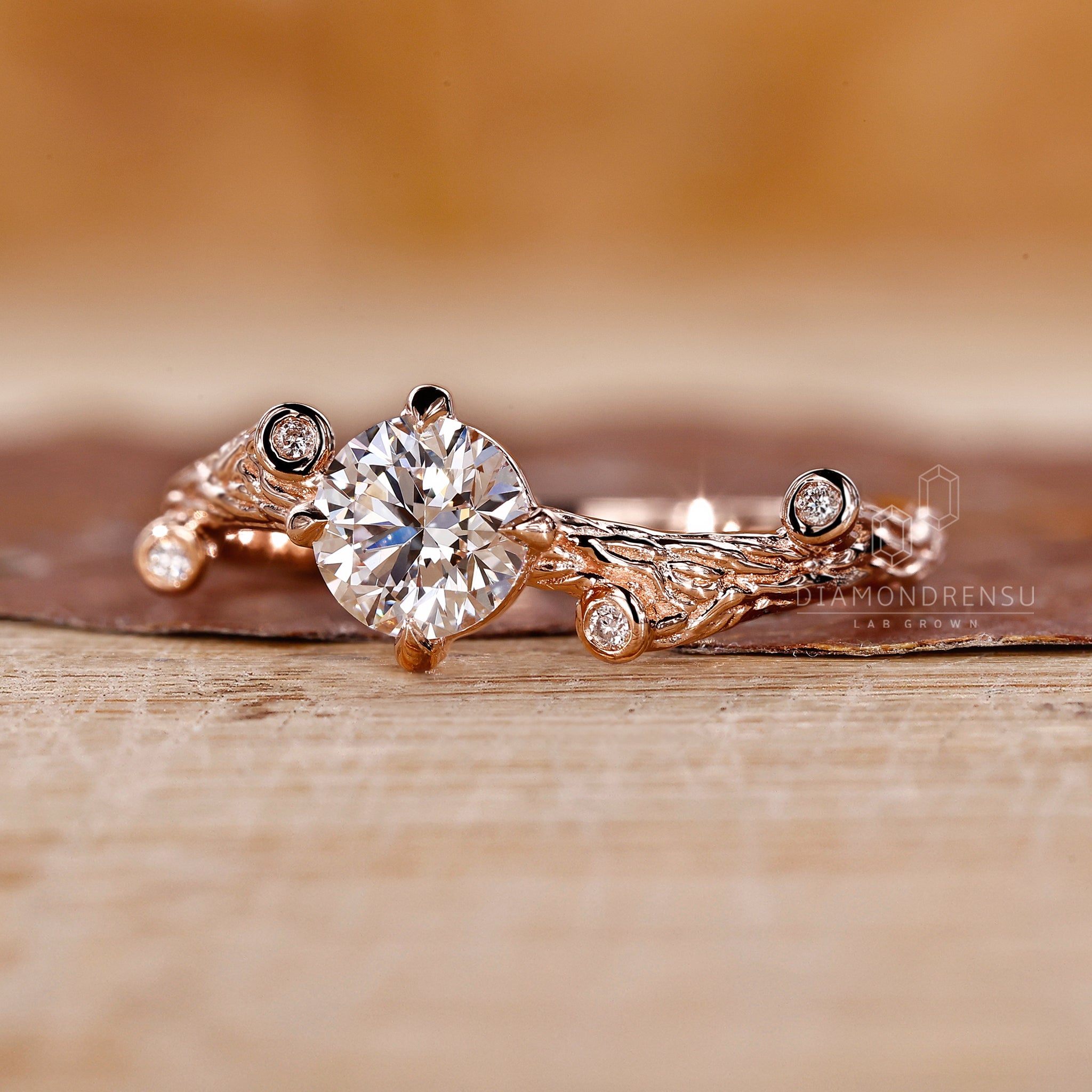 Round cut diamond engagement ring with rose gold ring
