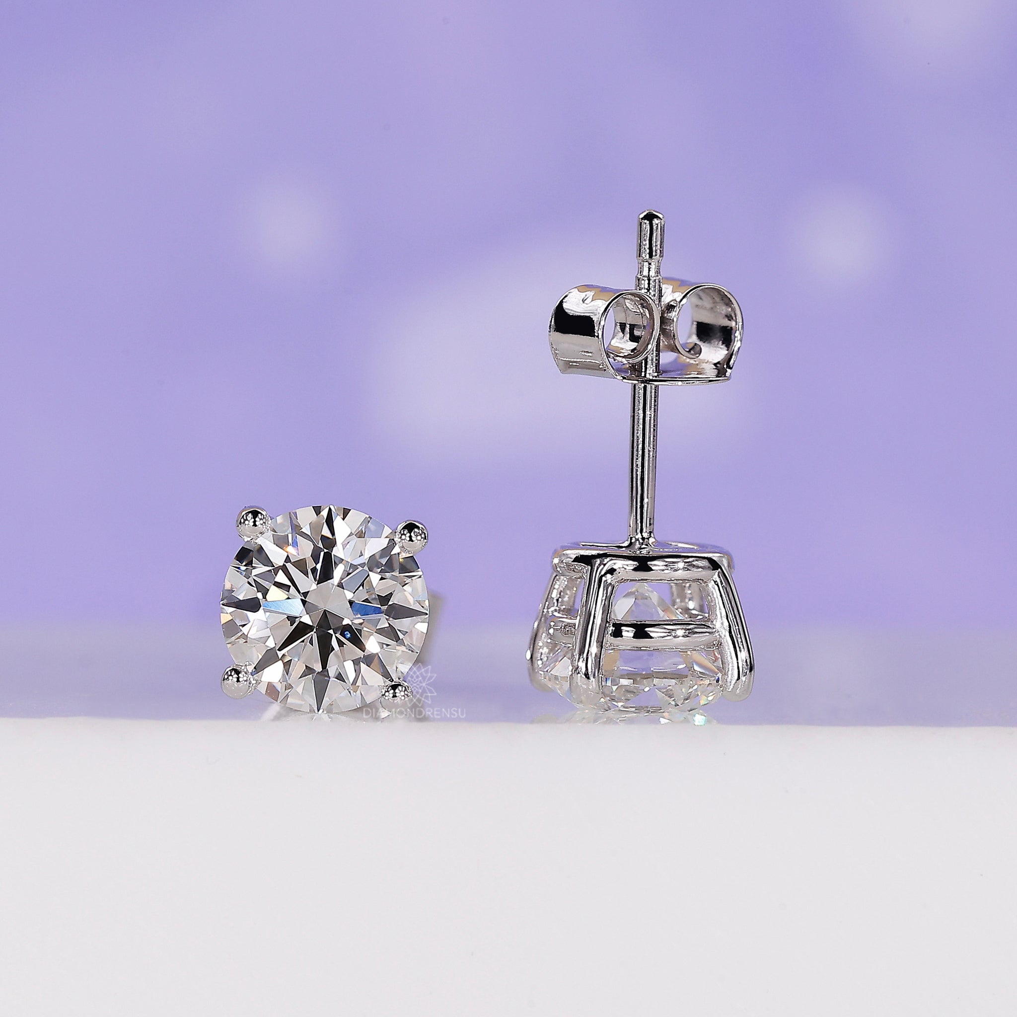Diamondrensu UK earrings showcasing round studs in handmade gold style.