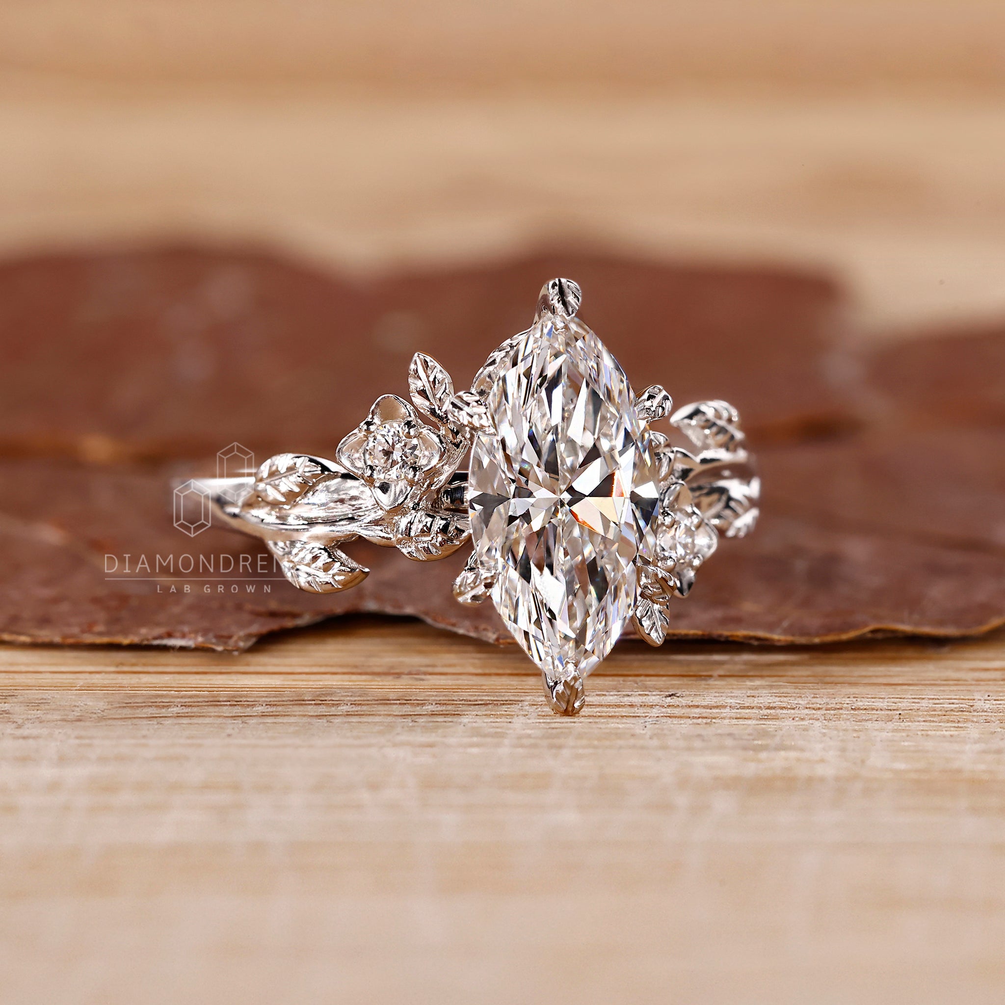 Round sidestone ring with six leaf style prong.

