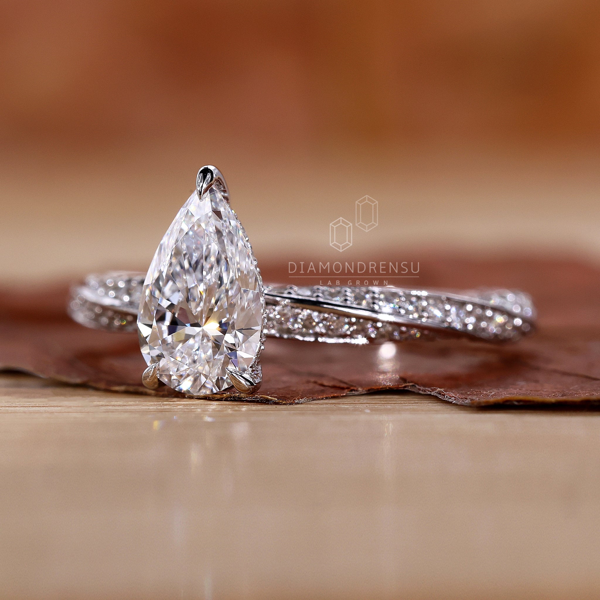 Elegant pear shaped diamond ring in a claw prong setting.