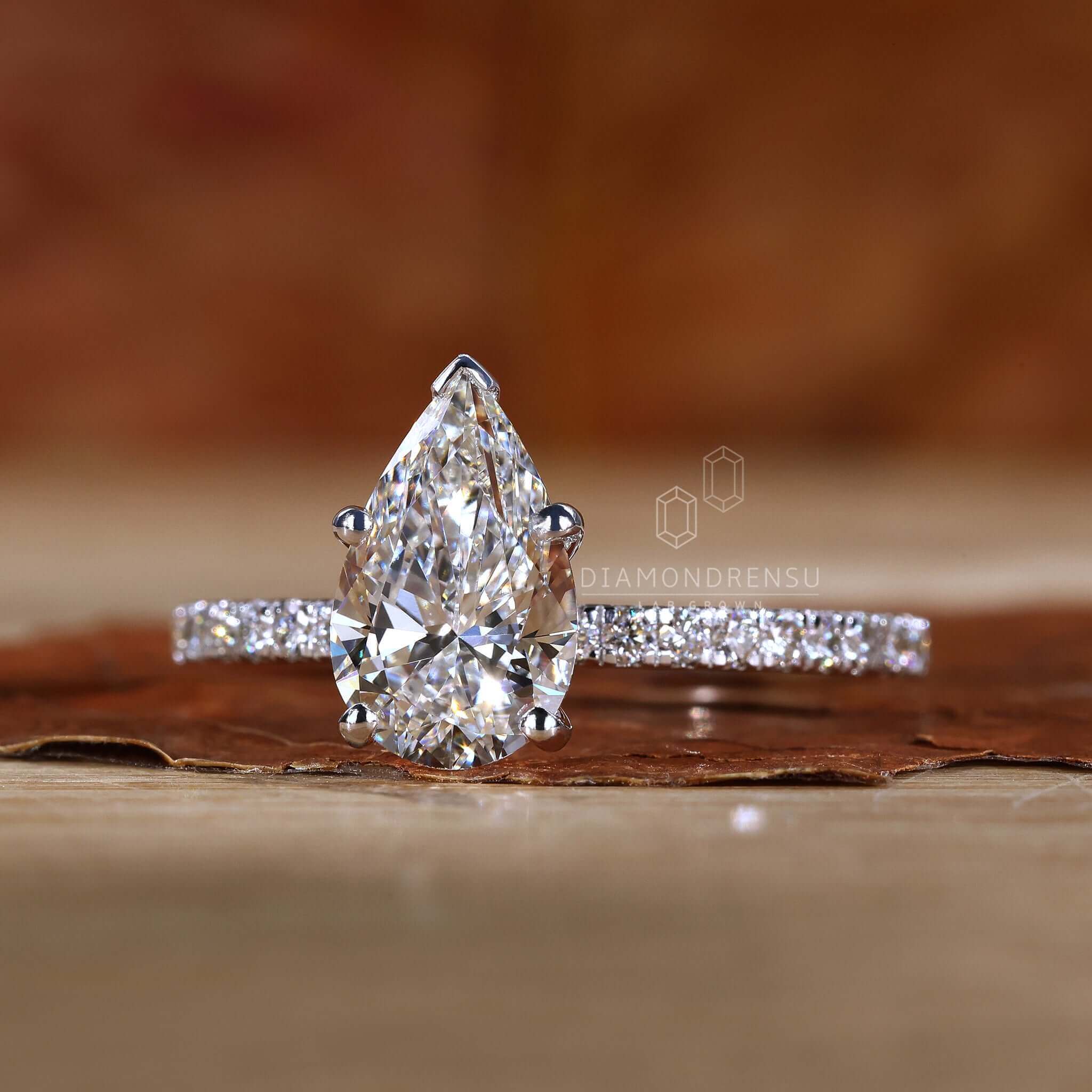 Pear cut diamond ring featuring a v prong setting for a modern touch.