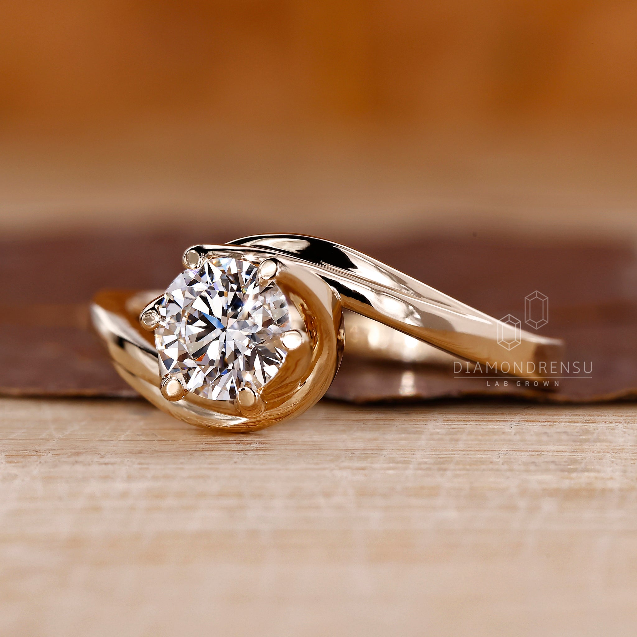Yellow gold engagement ring with bypass design.
