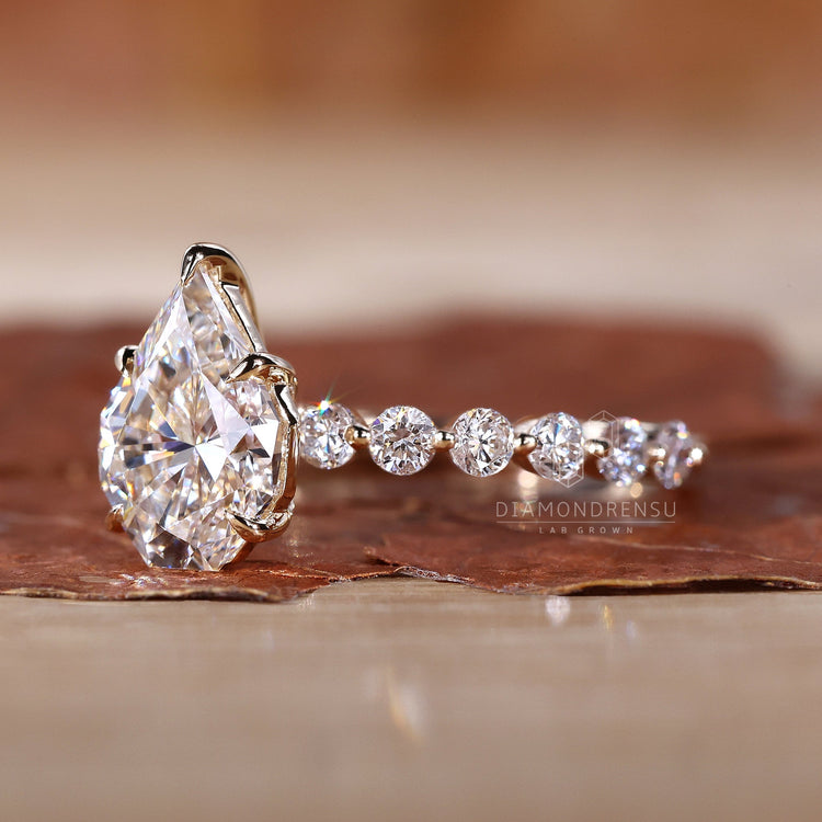 Spear cut ring with a claw prong setting in gold.