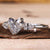 Heart shaped engagement ring with pear side stones