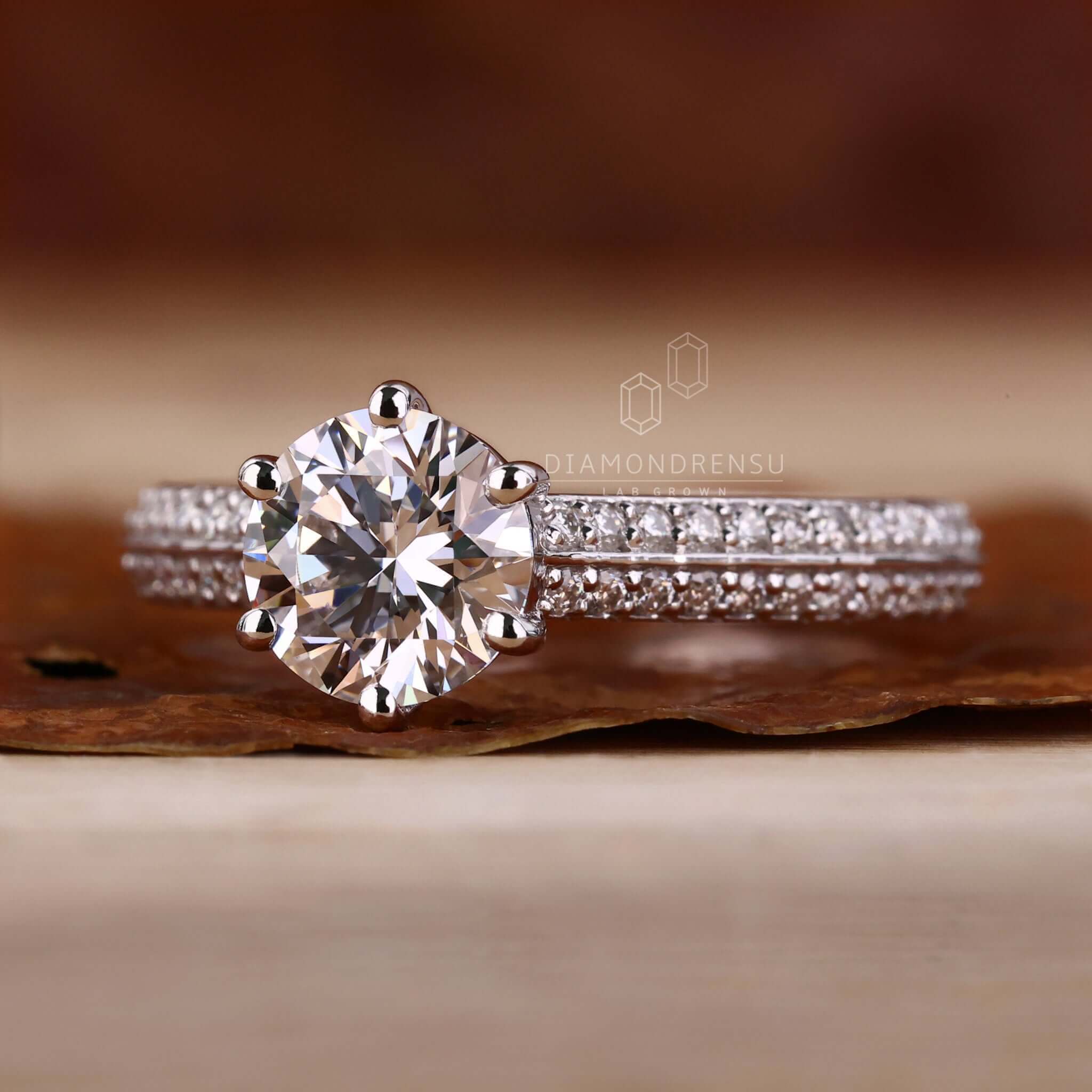 Edge banding knife design with a round cut diamond and a cathedral setting engagement ring for unmatched brilliance.