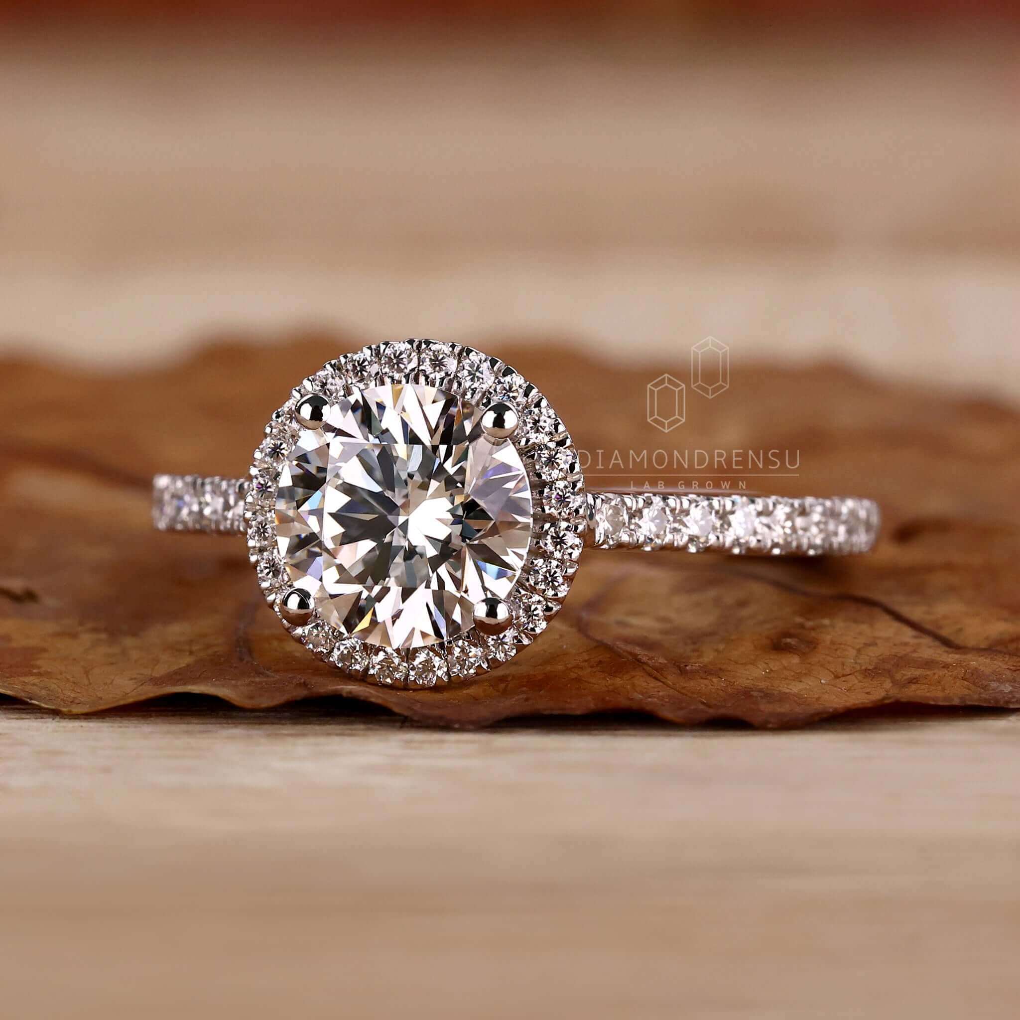 Halo diamond ring with exquisite detailing and brilliance.