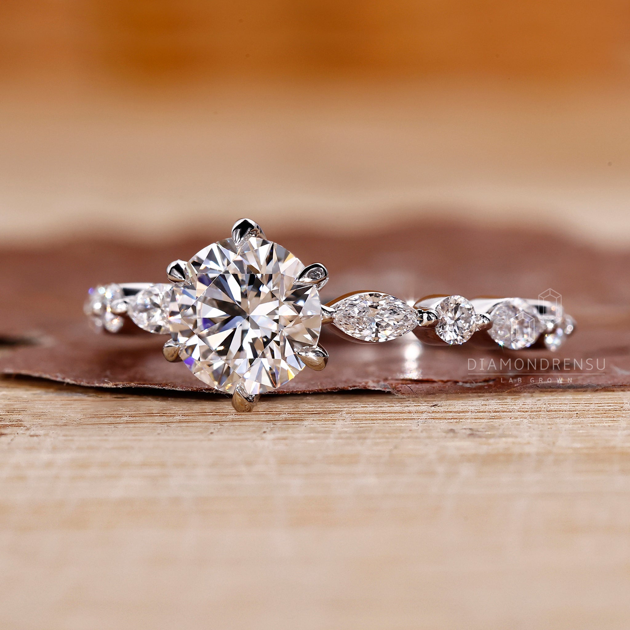 Buy engagement ring online with custom round cut diamond and side stones.
