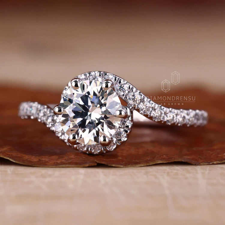 Bypass engagement ring featuring a six prong diamond ring for modern sophistication.
