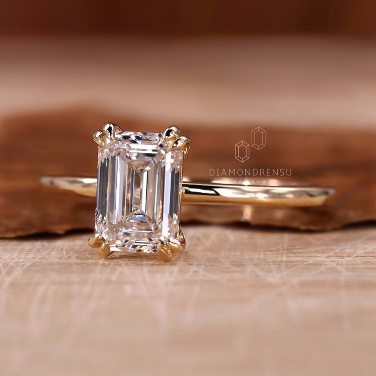 Solitaire emerald ring crafted for understated elegance and charm.