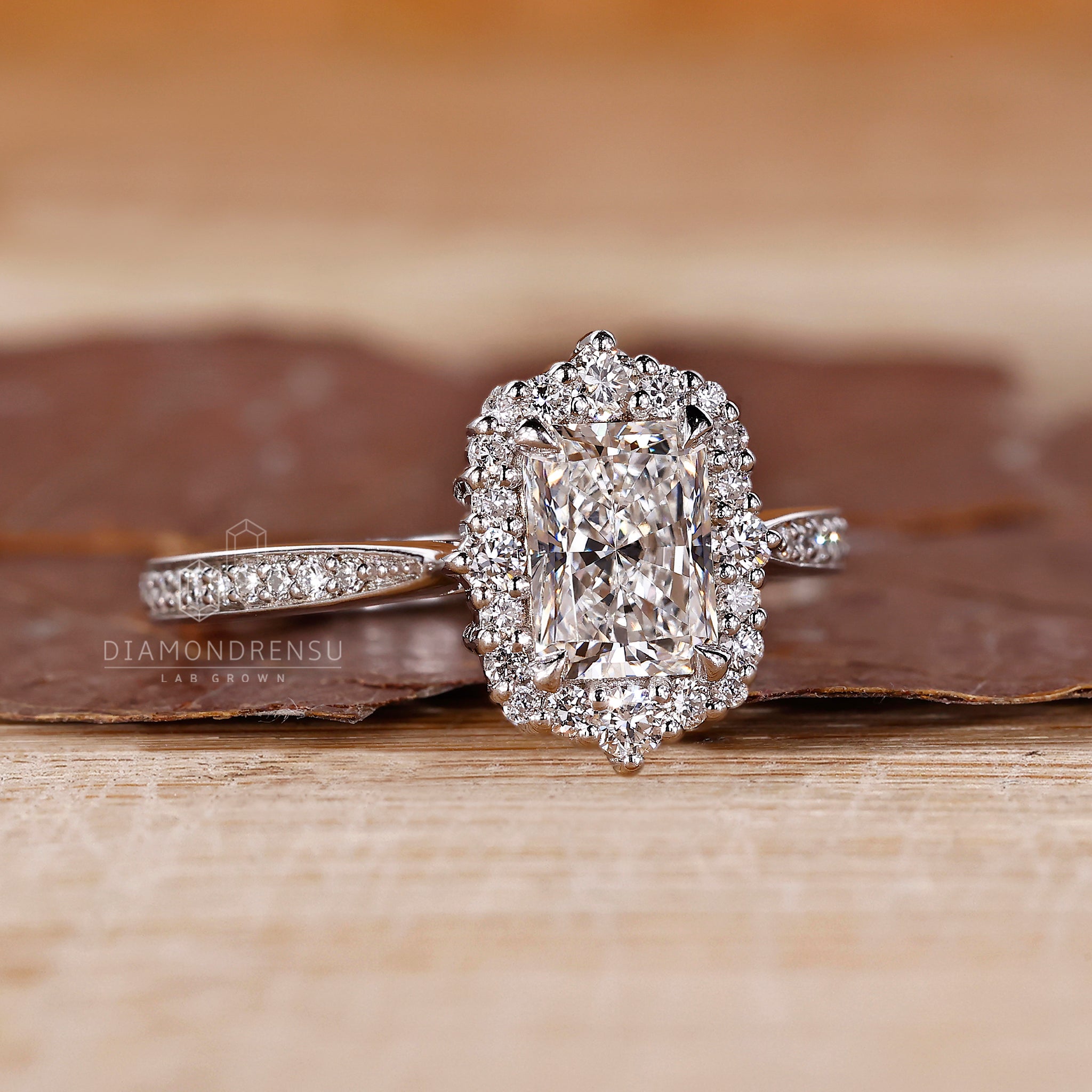 Cathedral setting with radiant cut and halo design.
