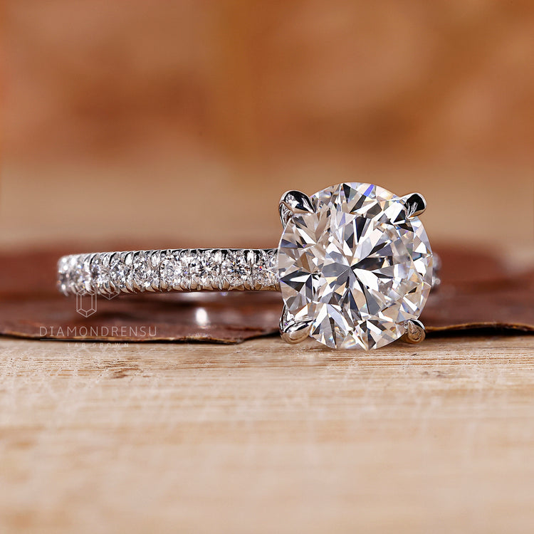 Classic round cut pavé setting handmade in the UK.
