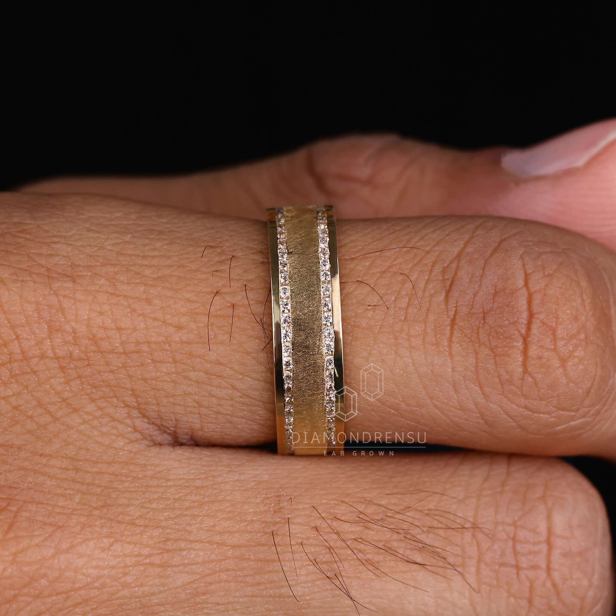 Mens gold wedding band with handmade jewellery detailing, perfect for a modern yet classic wedding look.