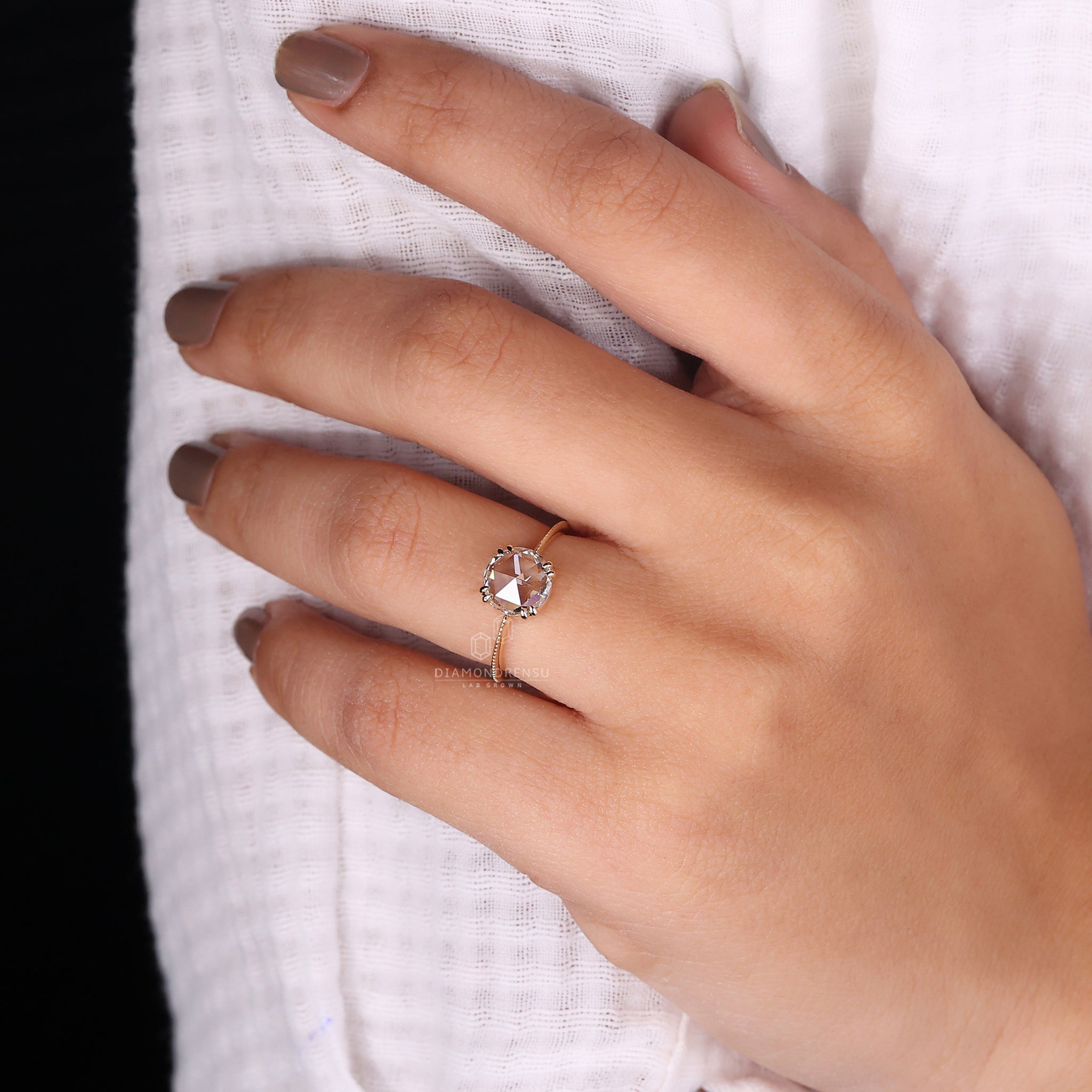 Yellow gold ring with solitaire rose cut diamond and hart shape prong set.
