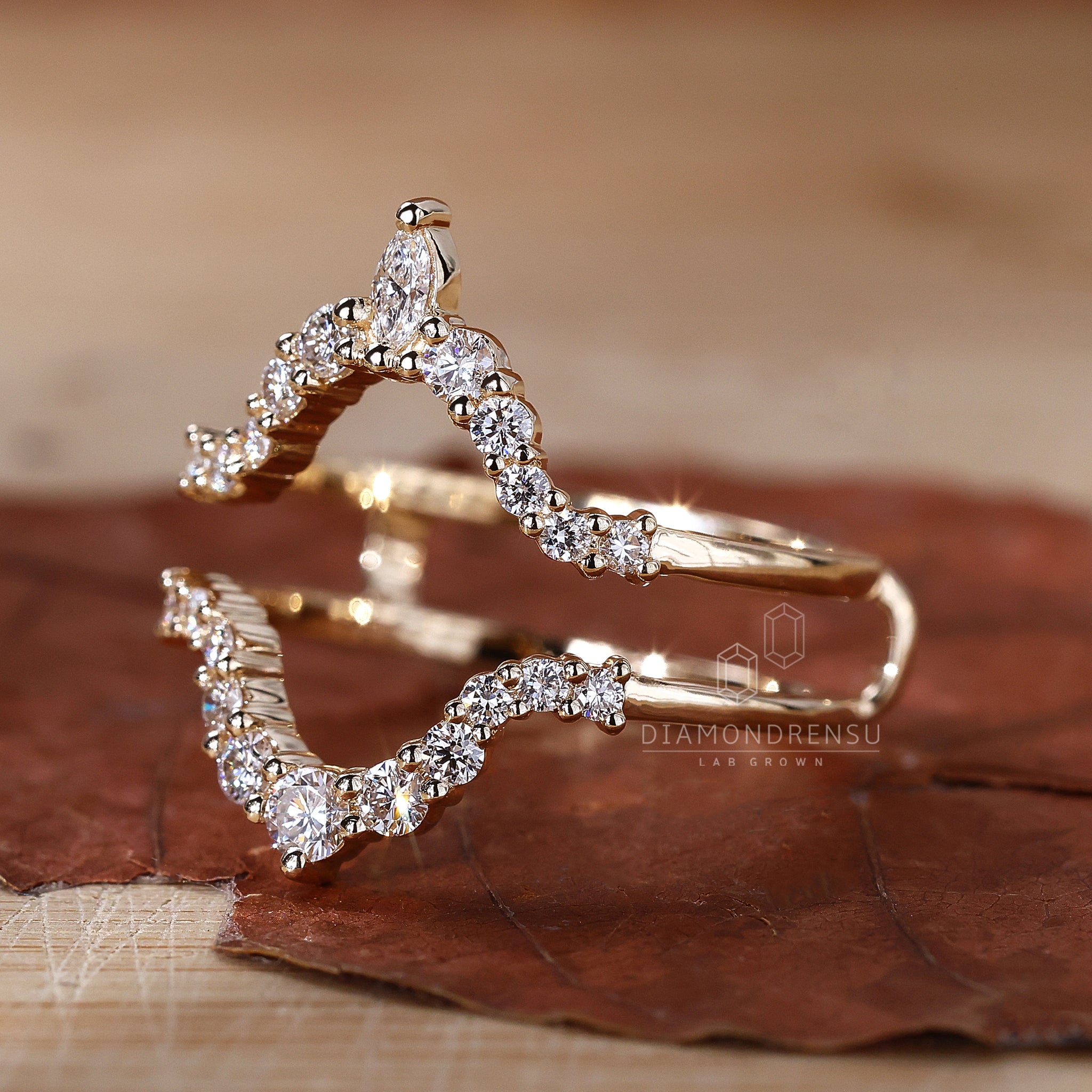 Yellow gold curved diamond wedding band.
