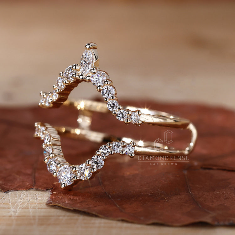 Yellow gold curved diamond wedding band.
