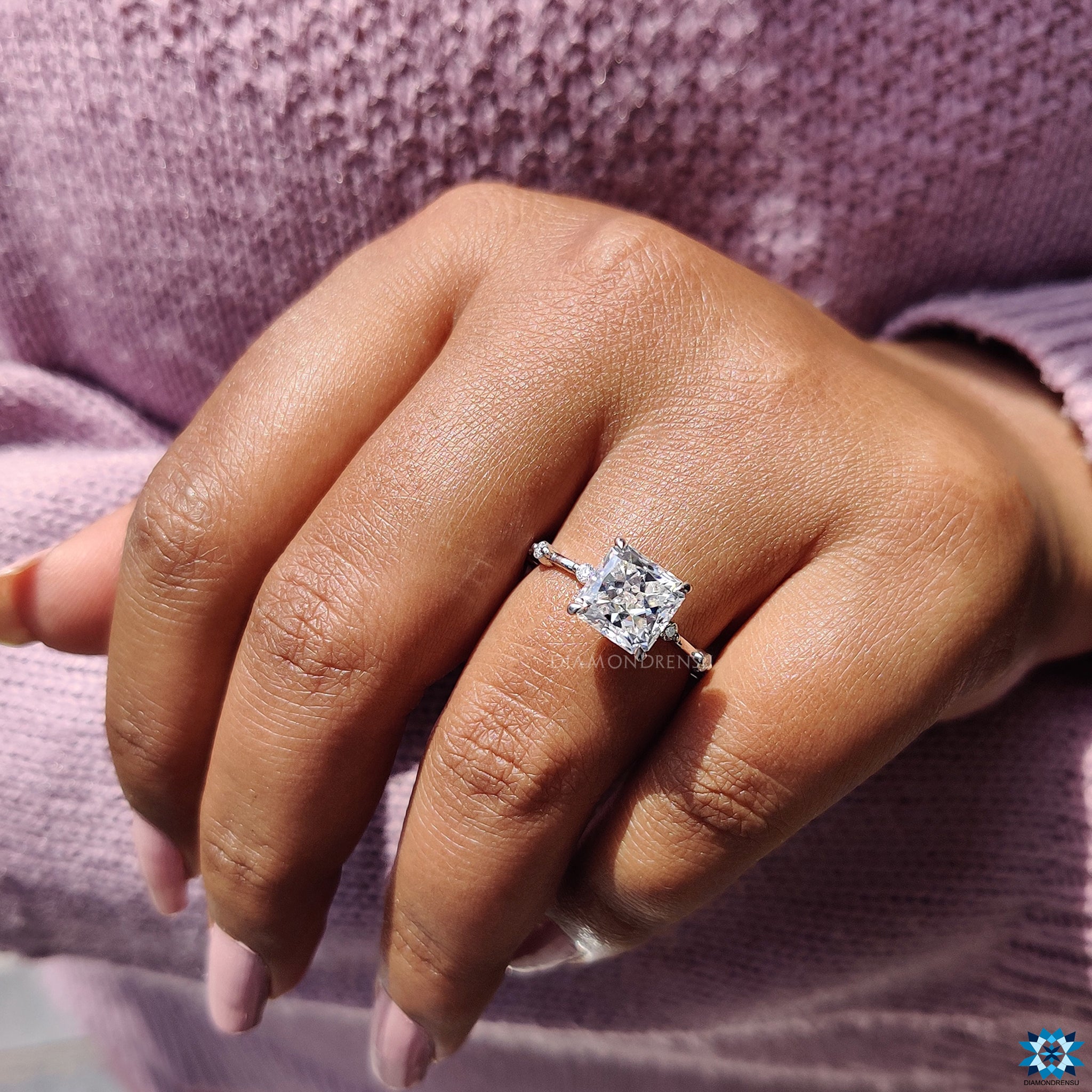 Buy moissanite ring with white gold, distance pave, and claw setting.
