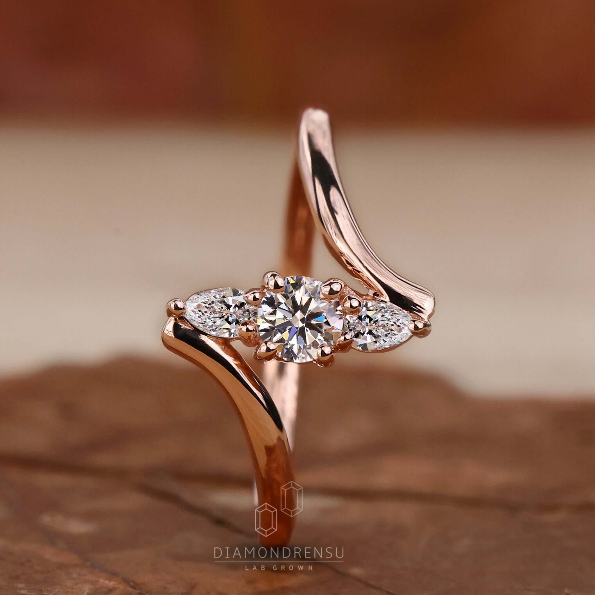 Diamond engagement ring in rose gold featuring a pear-shaped ring diamond for a unique touch.