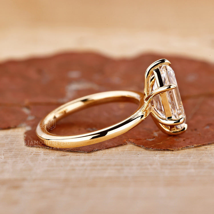 Custom diamond ring with 6 prong claw setting and geometric shape.
