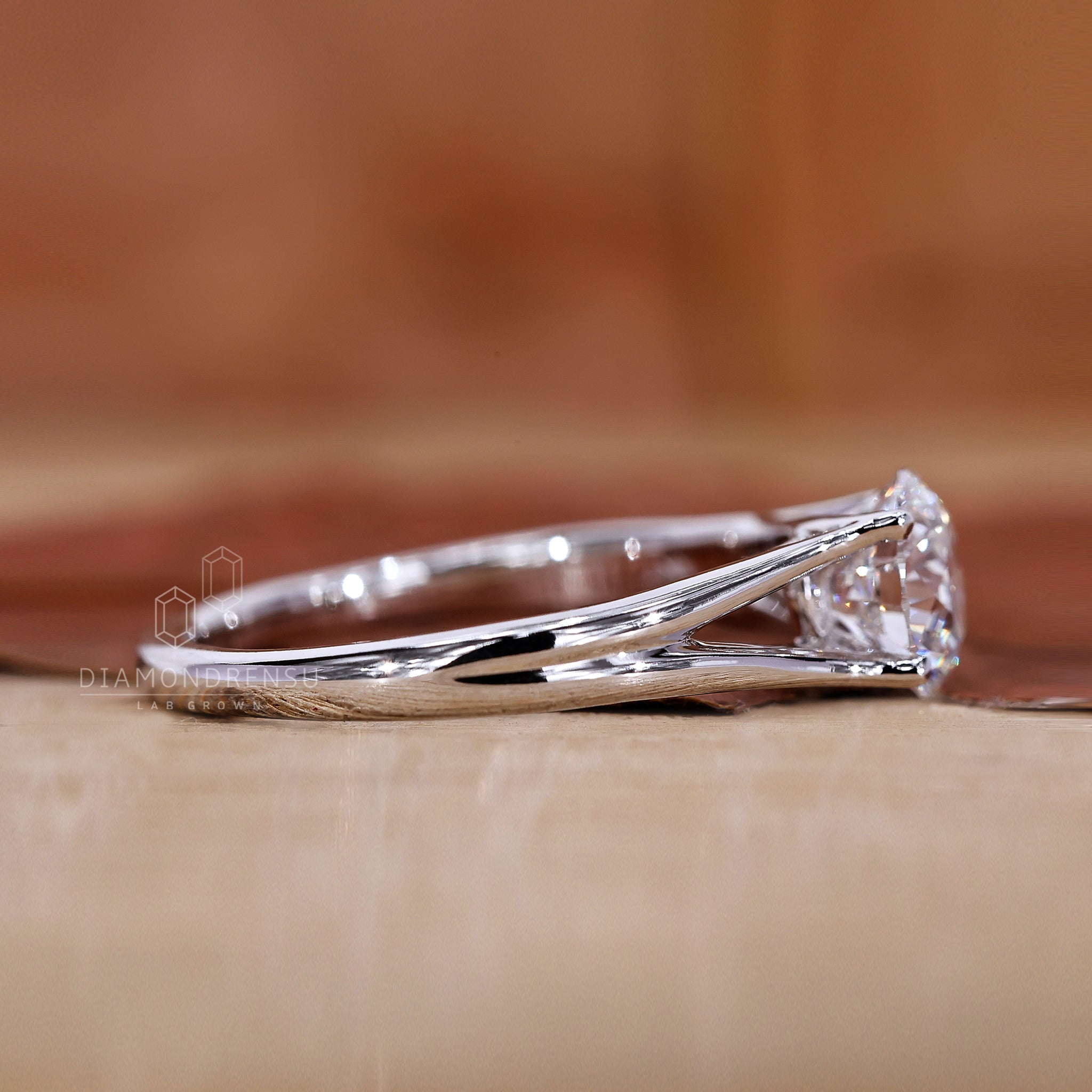 Handmade ring with split shank and round diamond details.
