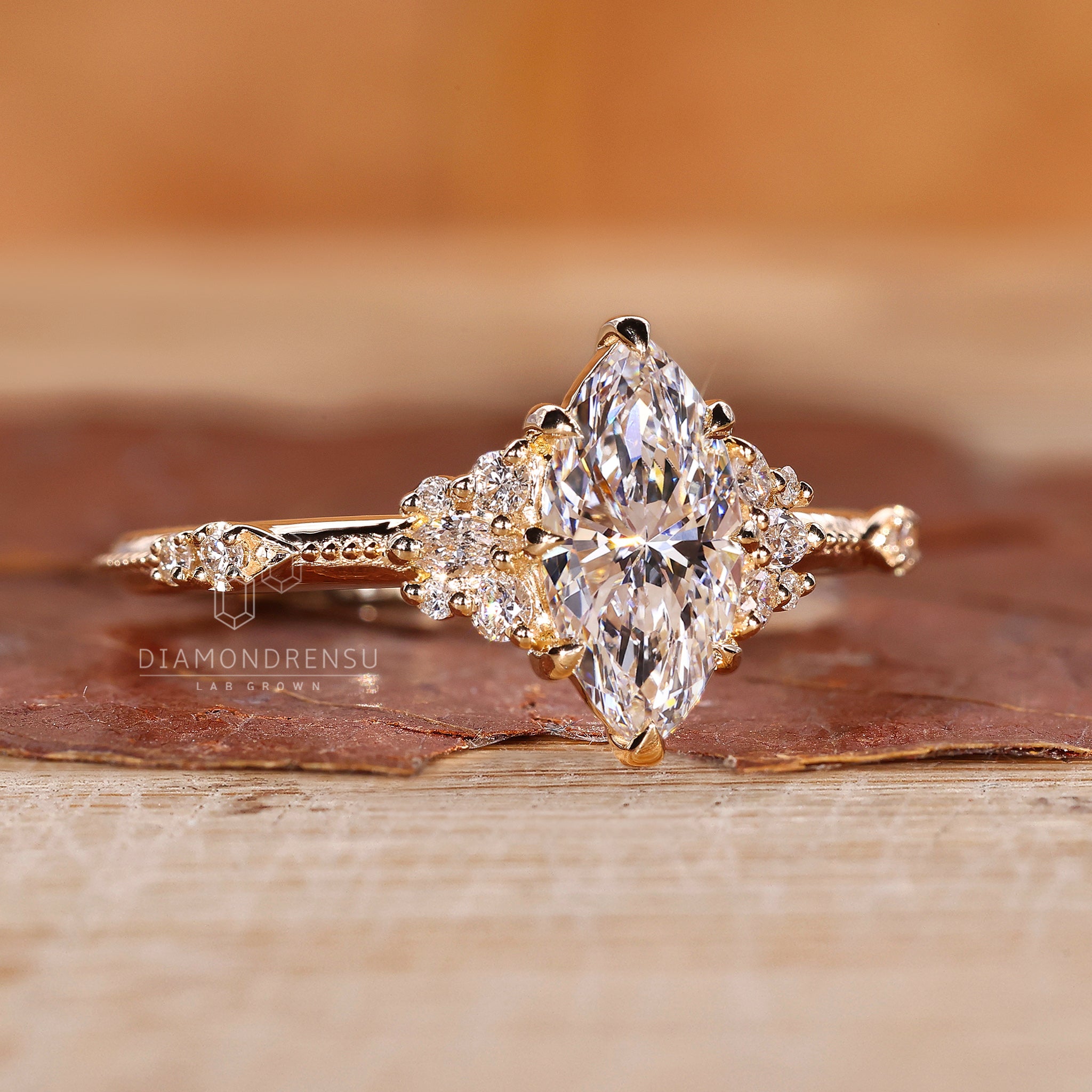 Gift for her with marquise cluster and round side stones.
