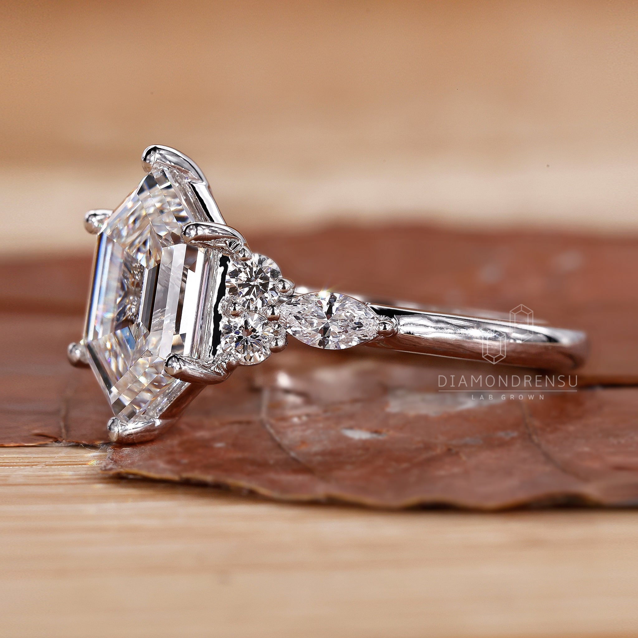 Side Stone Engagement Ring with a beautiful hexagon centre diamond.