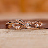 Nature inspired wedding band with leaf detailing and round cut diamonds.