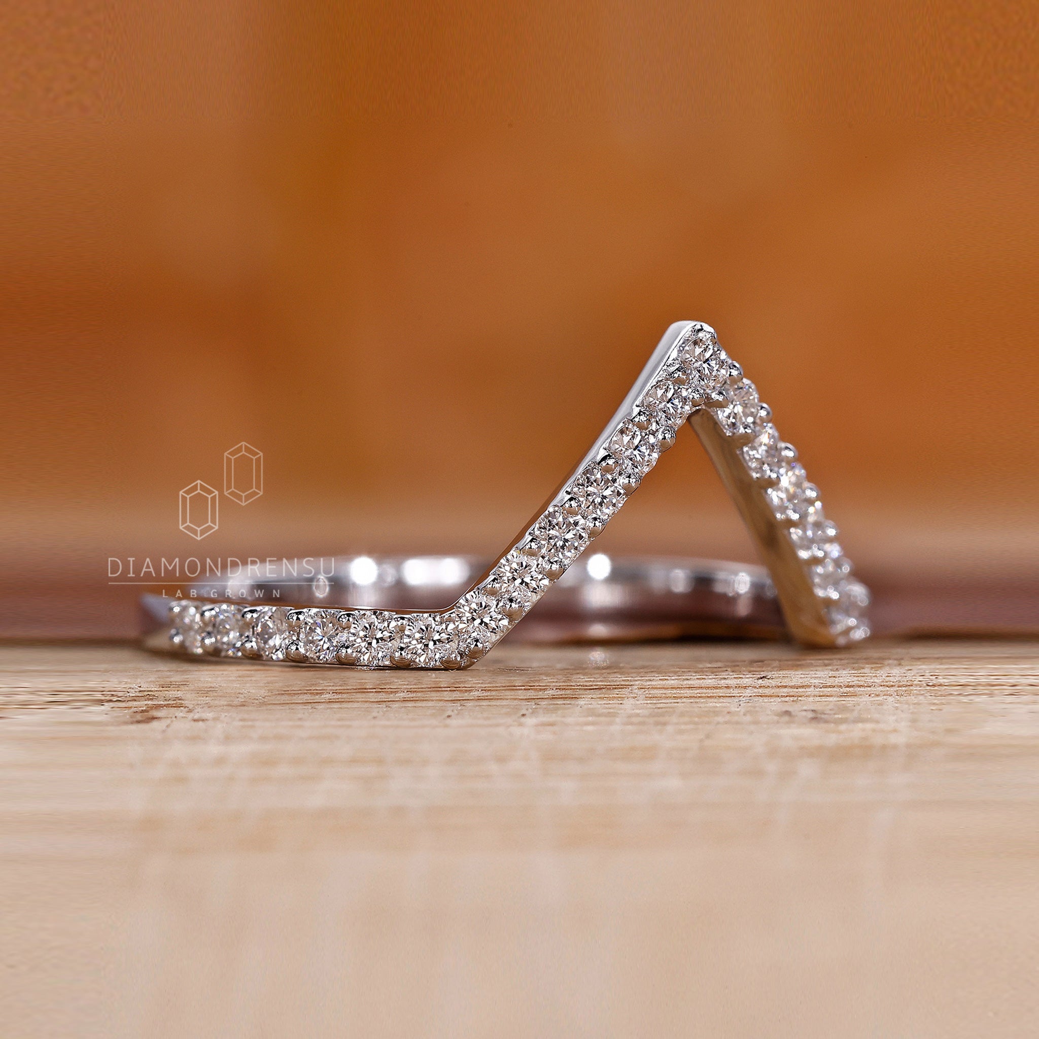 Simple wedding band designed in white gold with handmade detail.