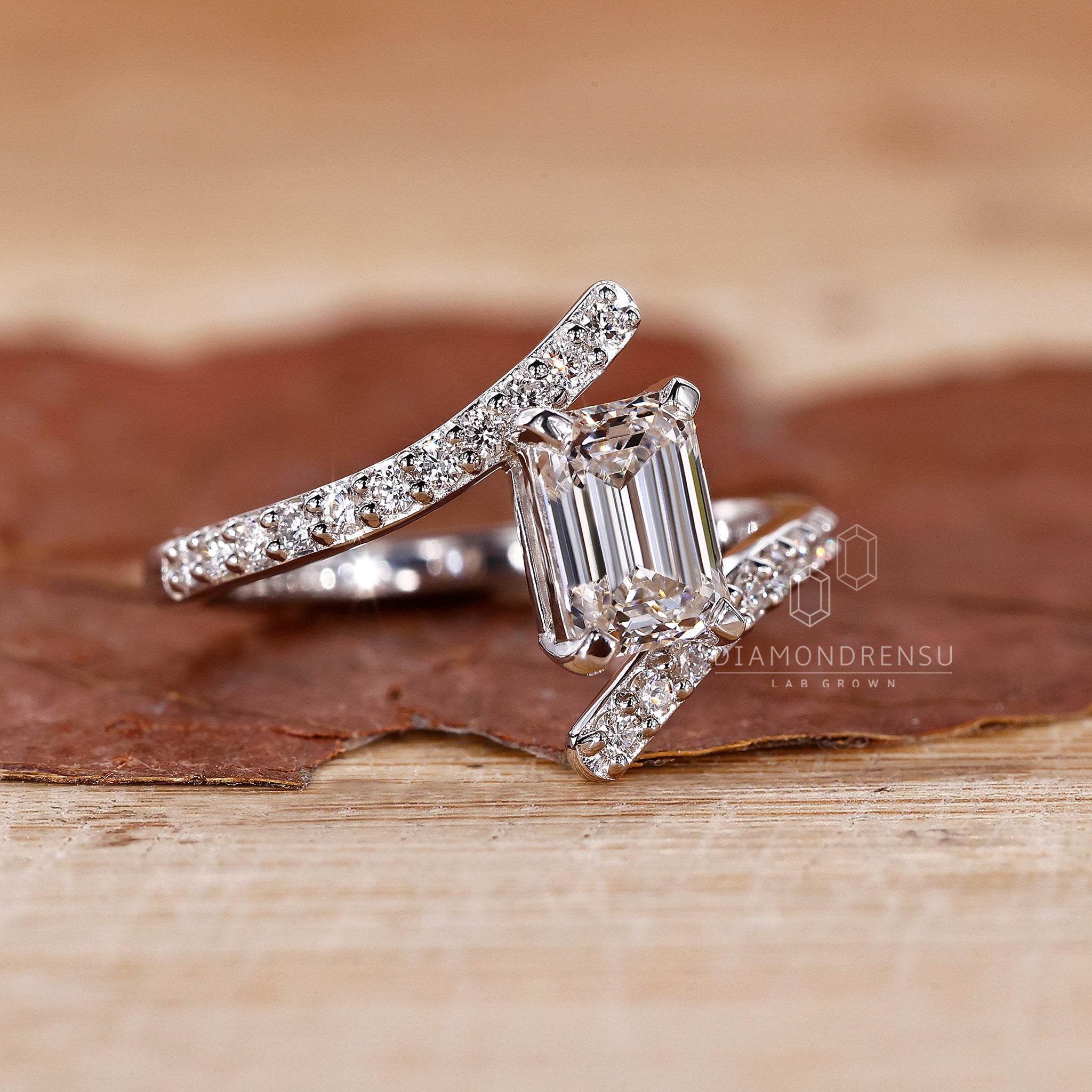 Lab grown diamond ring with custom emerald shape and prong setting.
