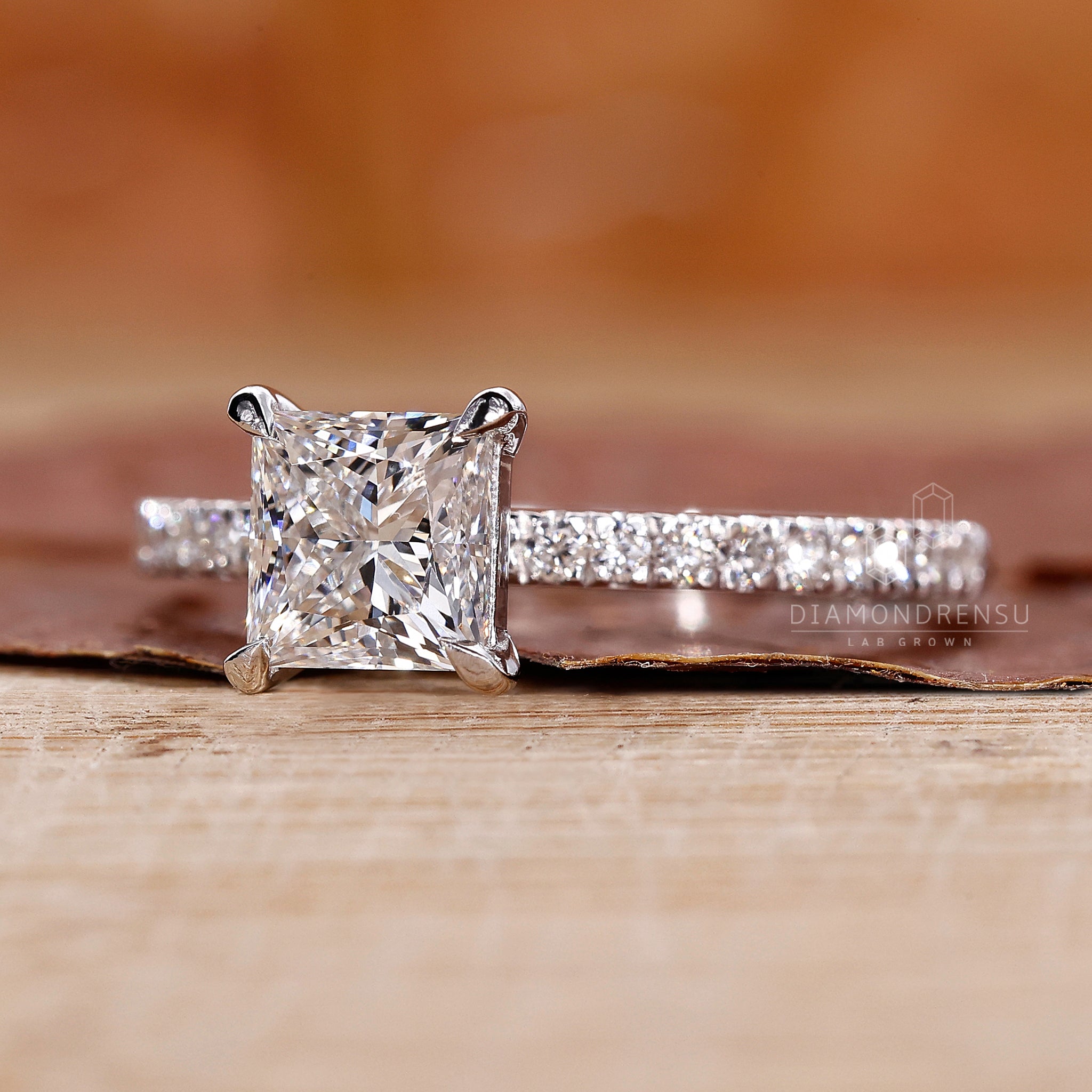 Princess pave ring with lab grown diamond center.
