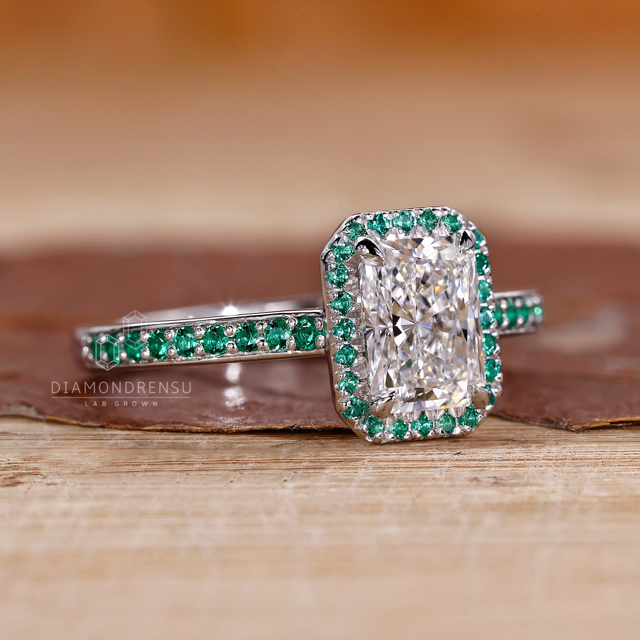 UK engagement ring with radiant centre and claw prongs.

