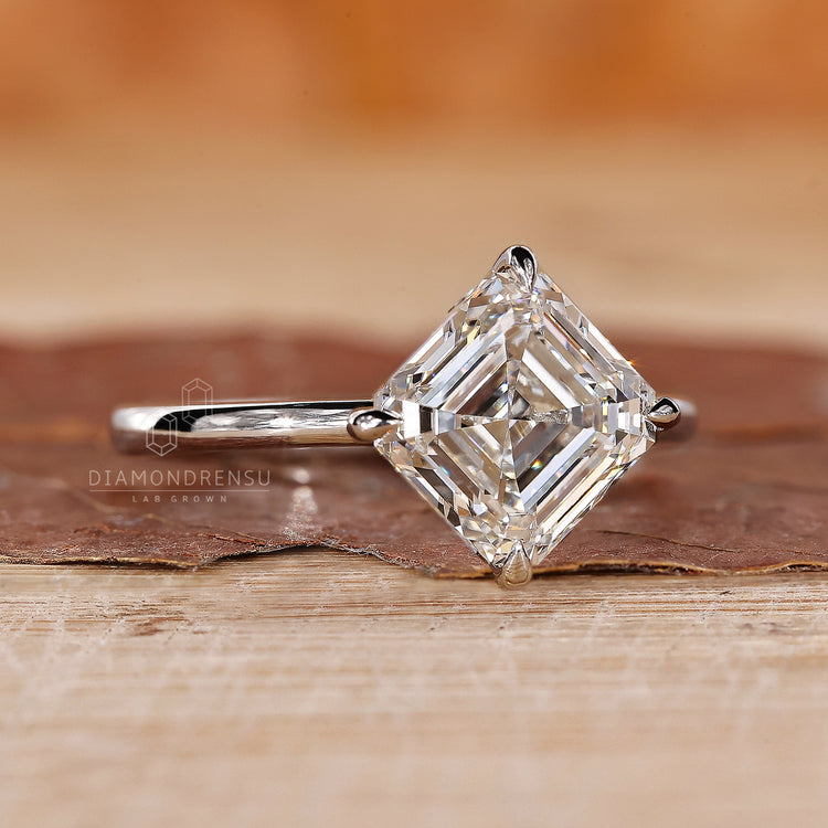 Engage Ring UK offers a compass prong with white gold and asscher diamond.
